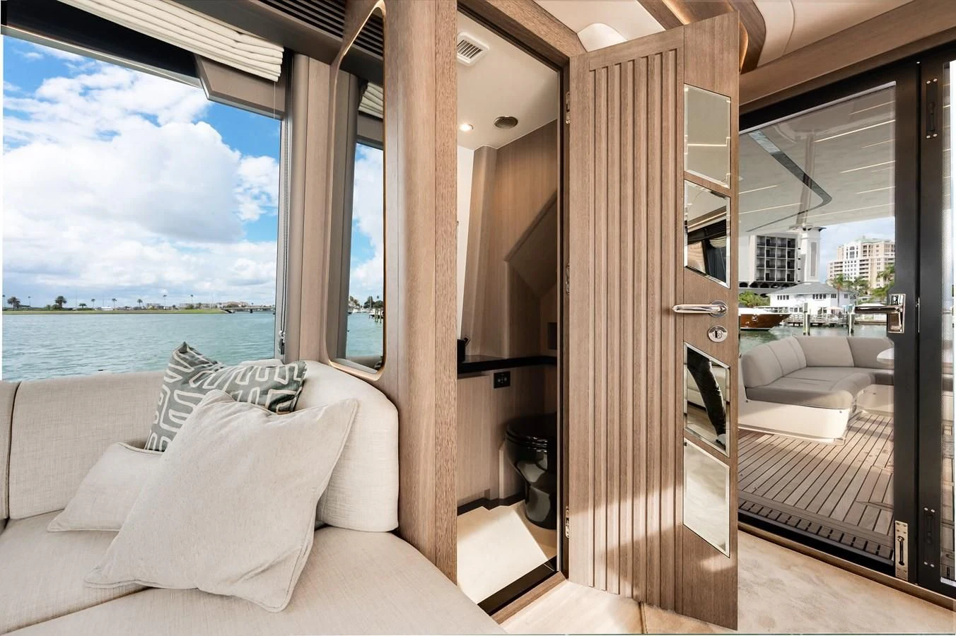 a room with a bed and a large window aboard 76 YACHT Yacht for Sale