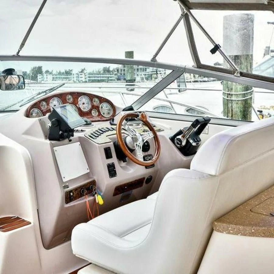 a white boat with a steering wheel aboard 76 YACHT Yacht for Sale
