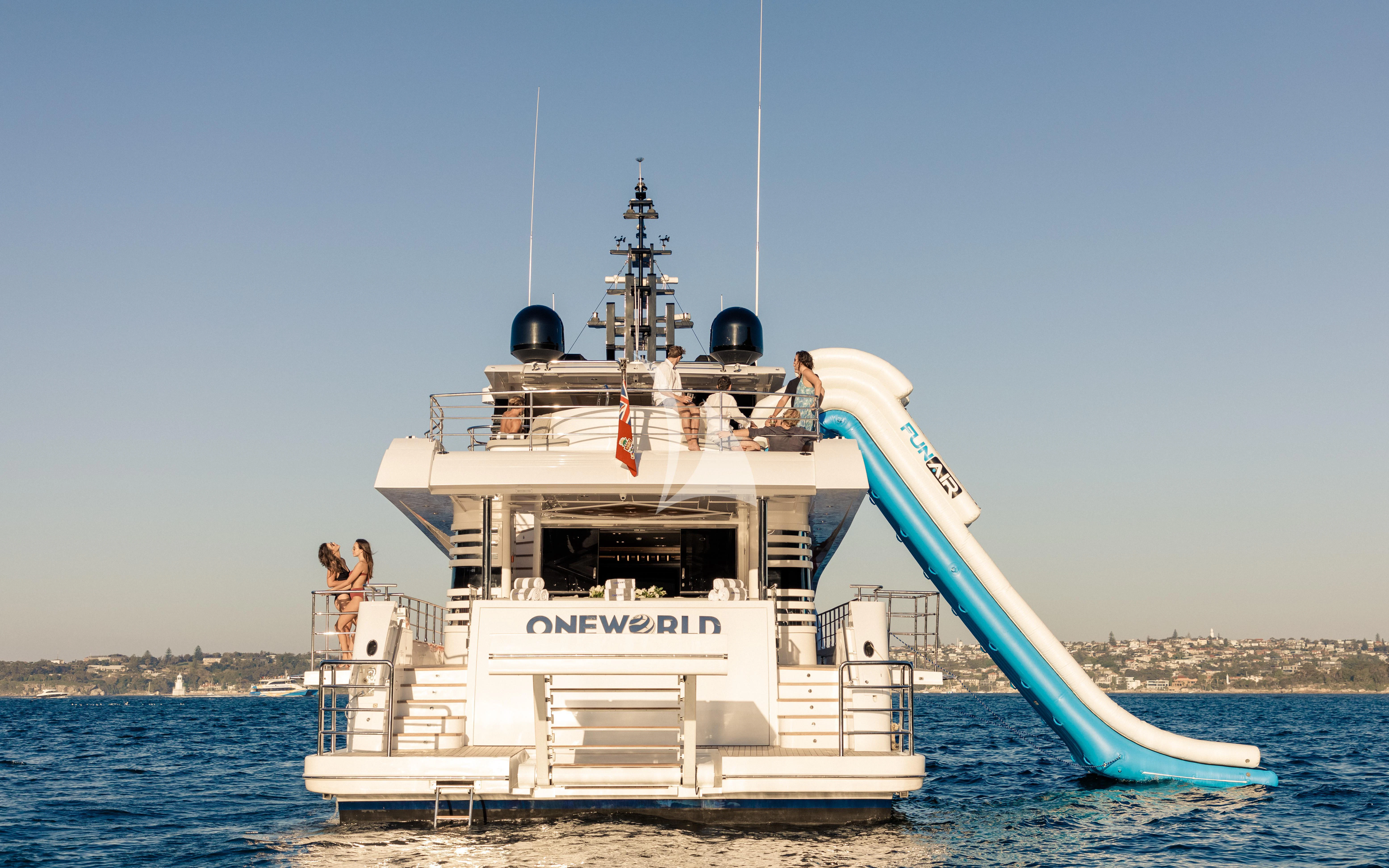 a boat with people on it aboard ONEWORLD Yacht for Sale