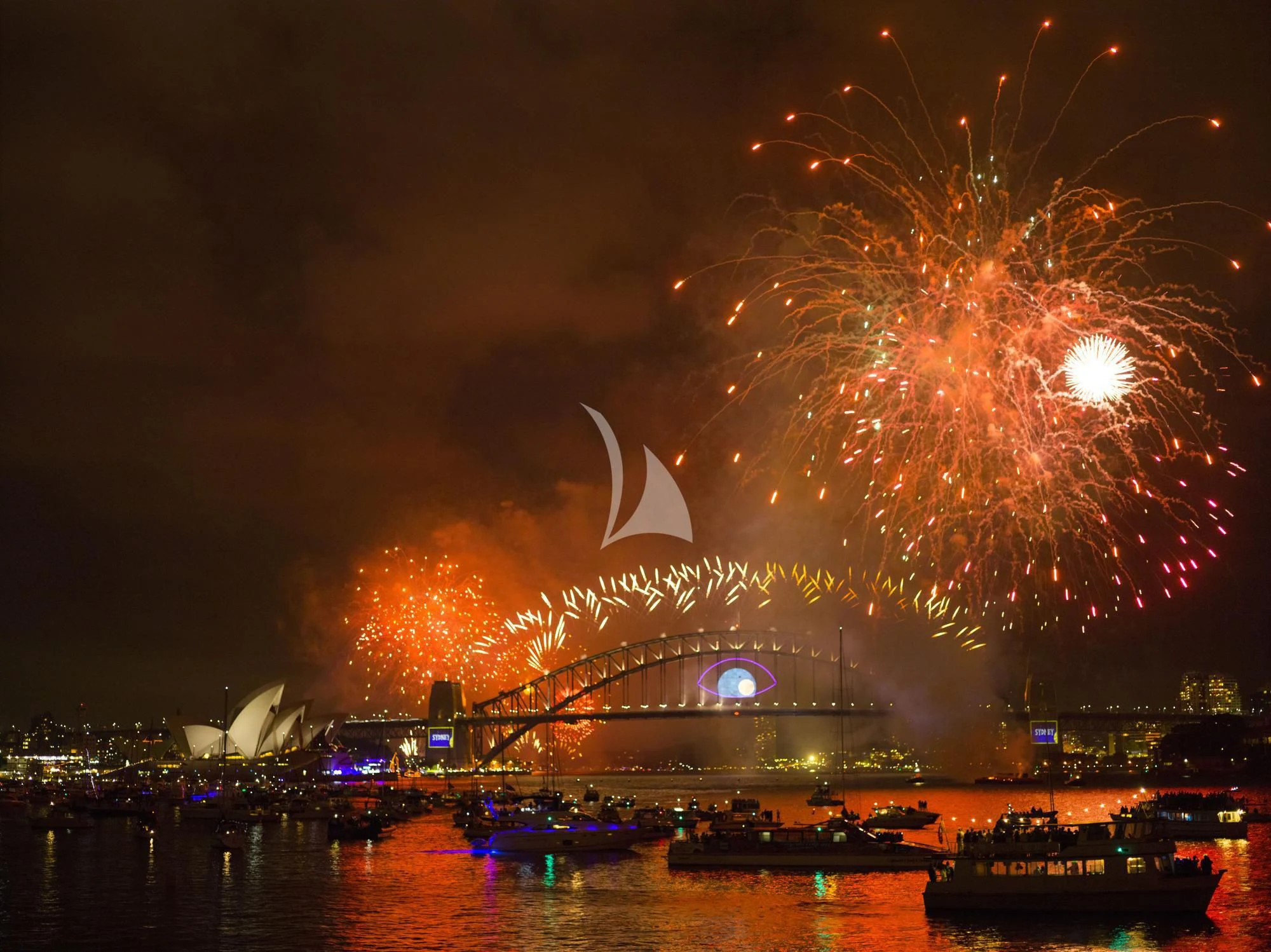 fireworks over a stadium aboard ONEWORLD Yacht for Sale