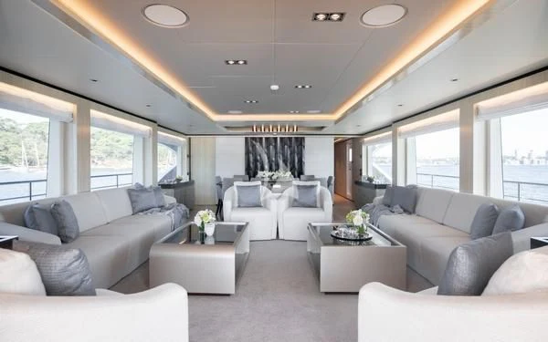 a living room with a large window aboard ONEWORLD Yacht for Sale