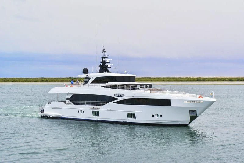 a white yacht on the water aboard ONEWORLD Yacht for Sale