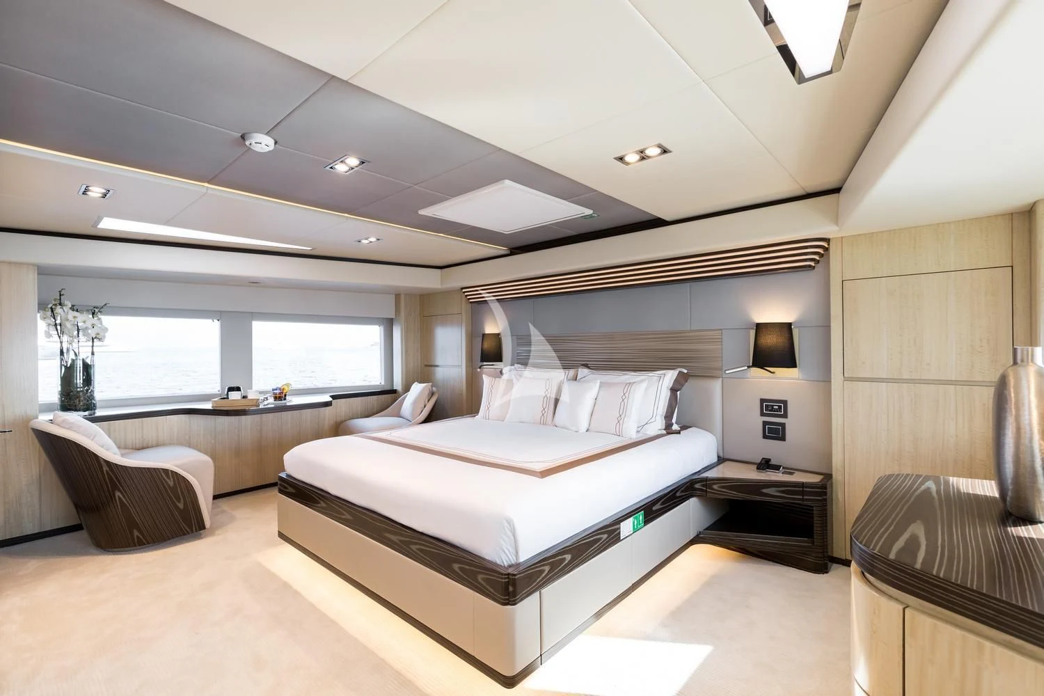 a large bedroom with a large bed aboard ONEWORLD Yacht for Sale