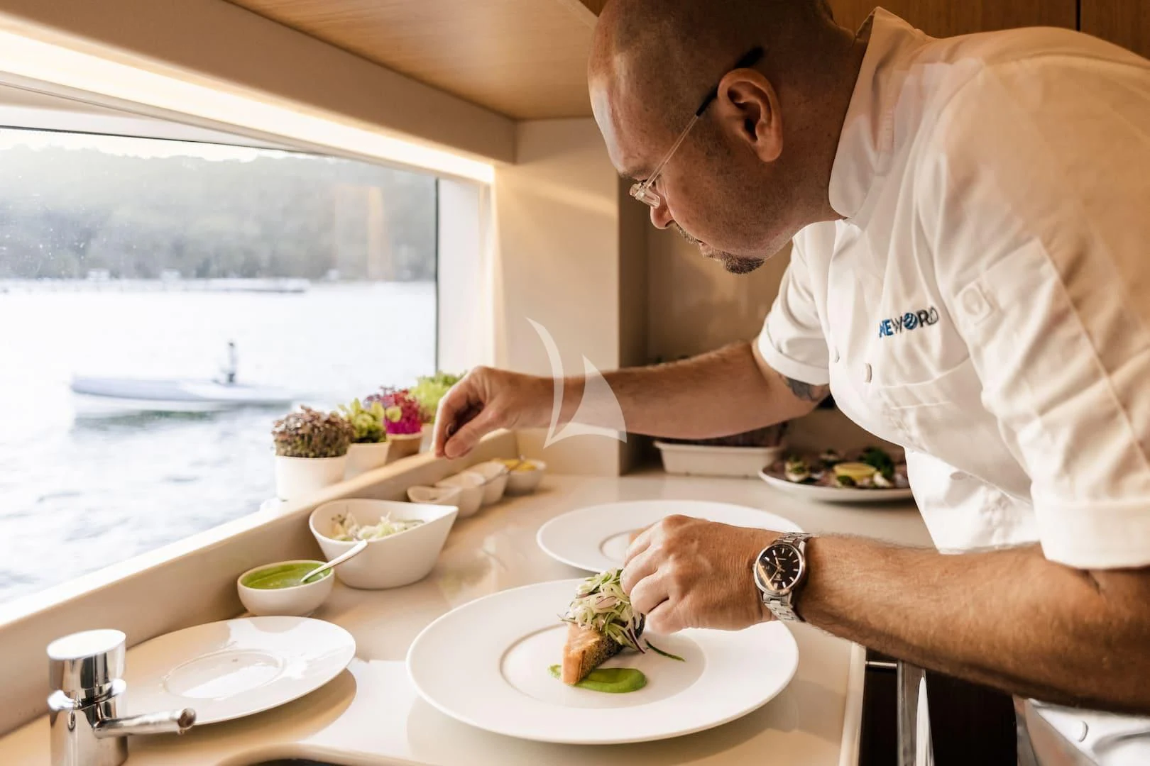 a man eating food aboard ONEWORLD Yacht for Sale