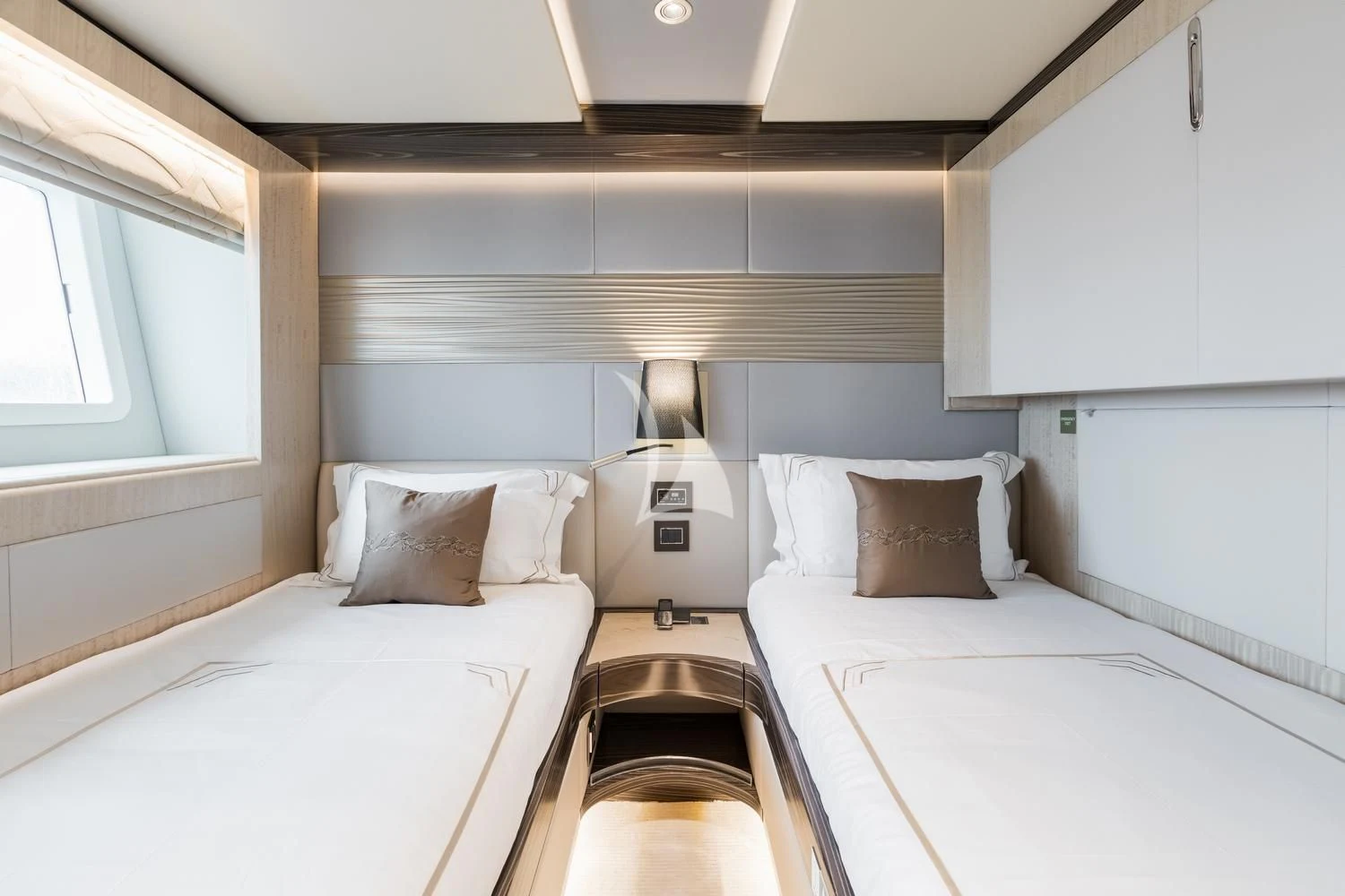 a couple of beds in a room aboard ONEWORLD Yacht for Sale