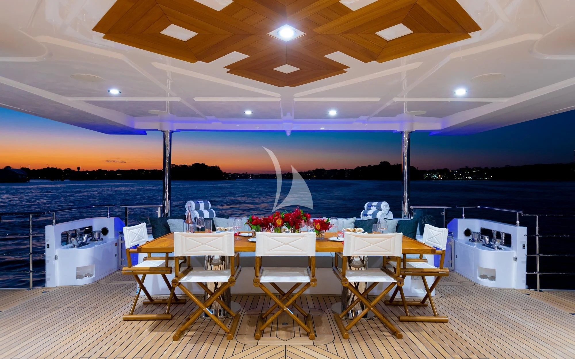 a room with tables and chairs aboard ONEWORLD Yacht for Sale