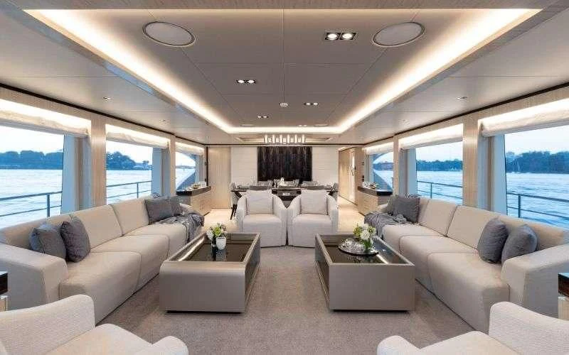 a living room with a large window aboard ONEWORLD Yacht for Sale