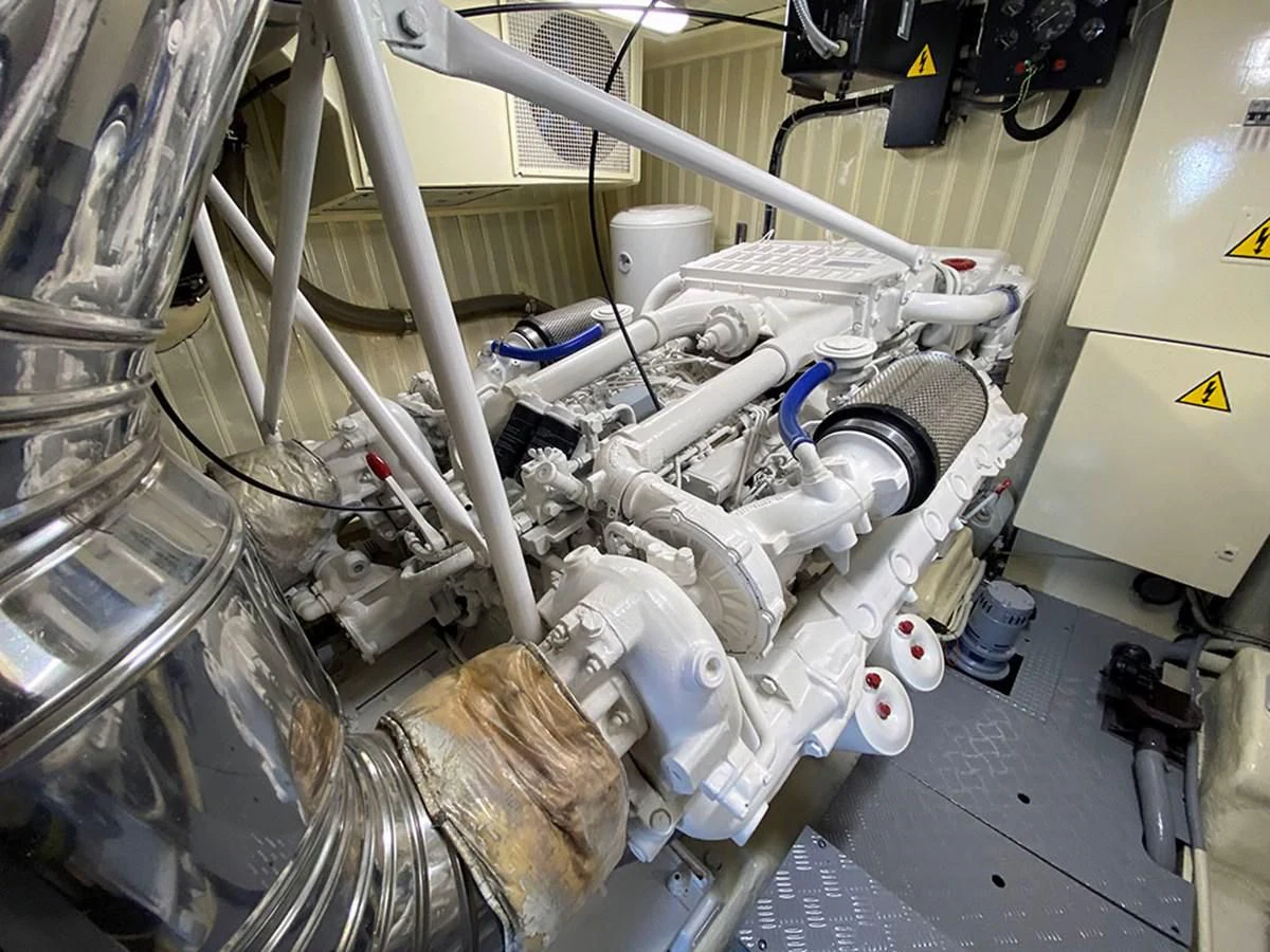 a person working on a machine aboard SPEED 5 Yacht for Sale