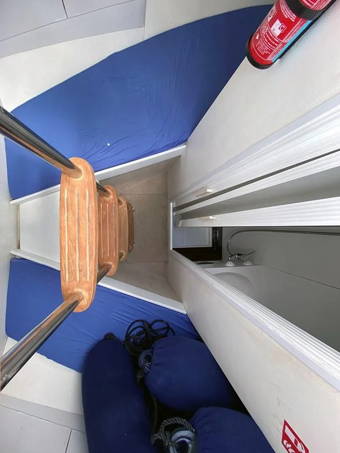a blue and white bathroom aboard SPEED 5 Yacht for Sale