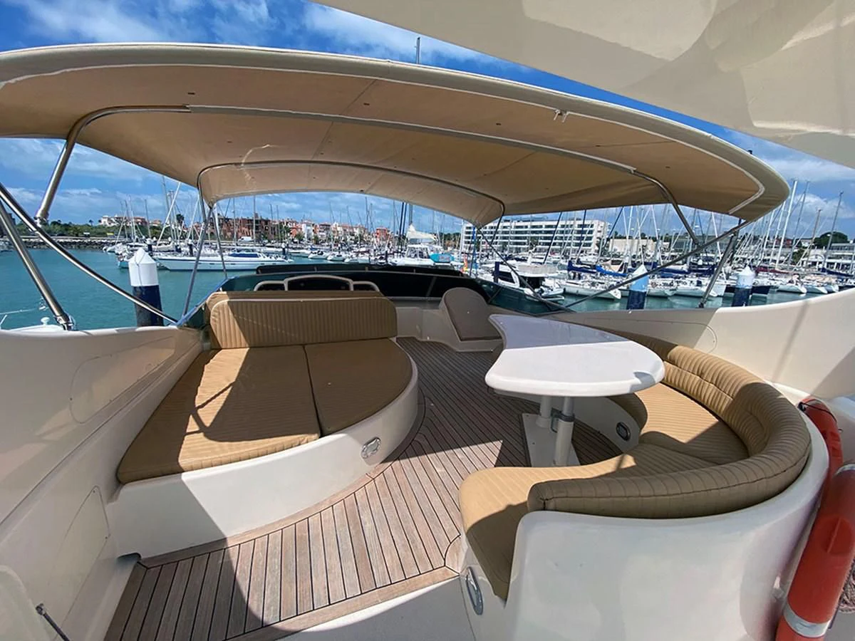 a lounge area with a view of the water and a city aboard SPEED 5 Yacht for Sale