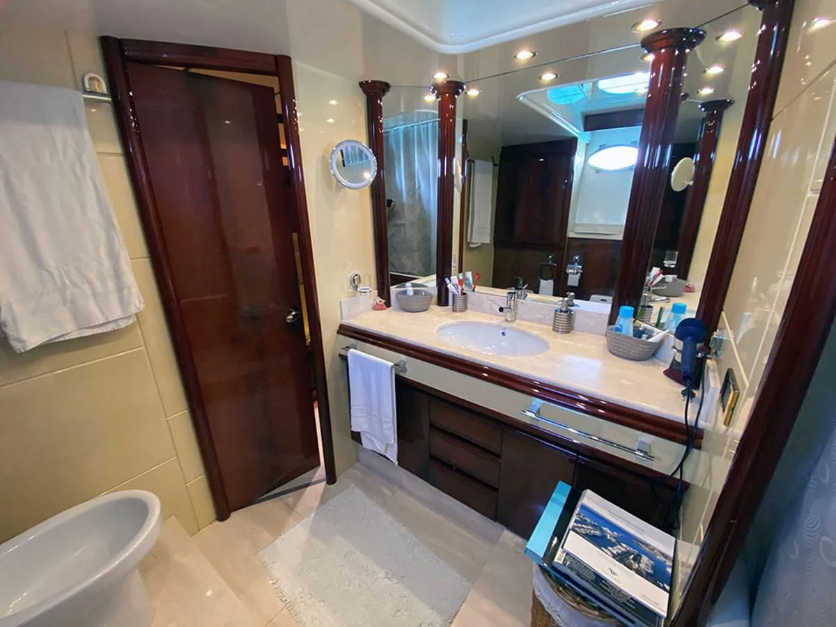 a bathroom with a large mirror aboard SPEED 5 Yacht for Sale