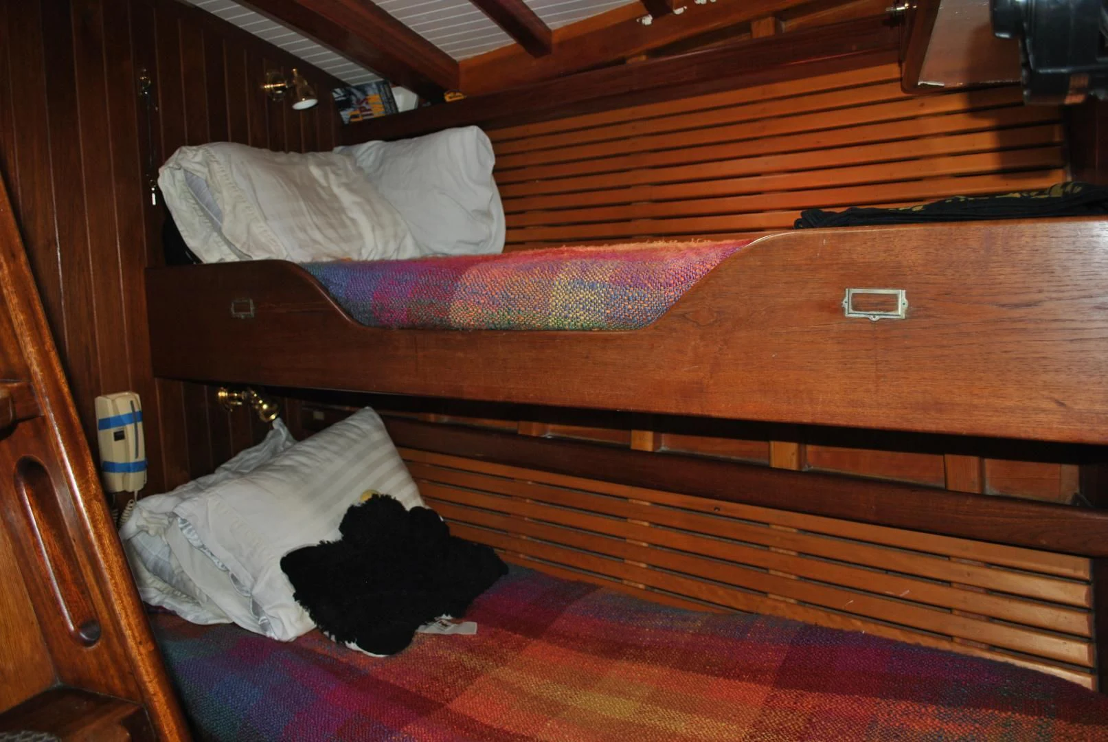a bed with a red blanket aboard TREE OF LIFE Yacht for Sale
