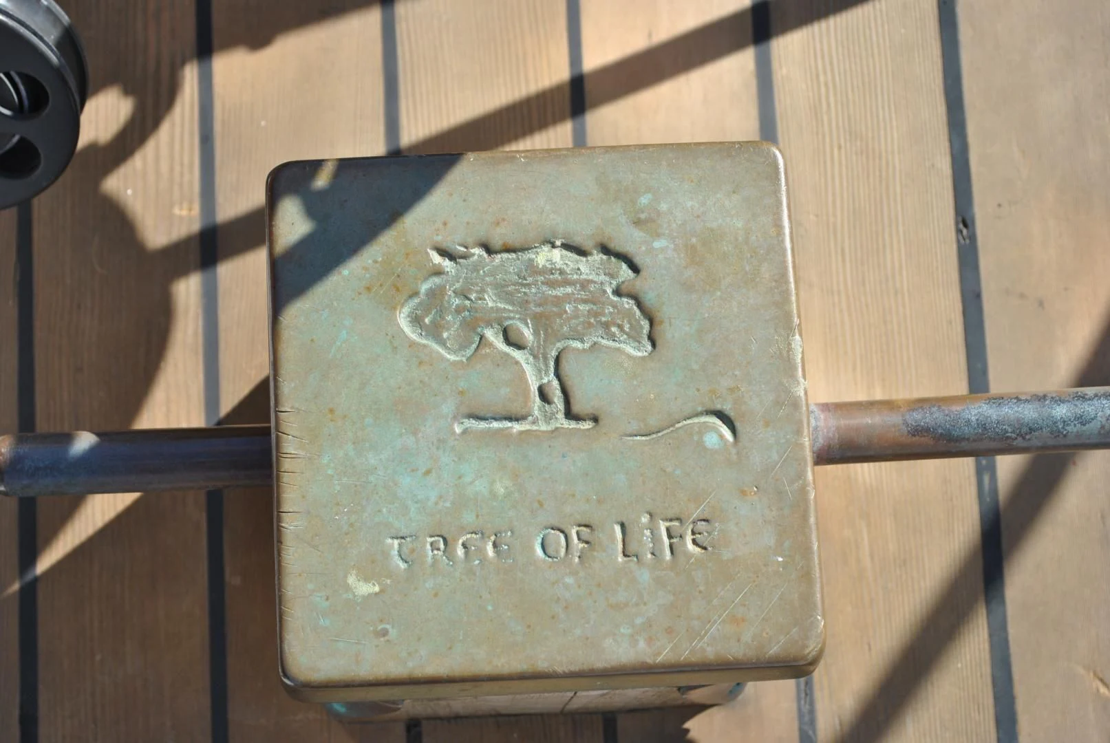 a coin on a wood surface aboard TREE OF LIFE Yacht for Sale