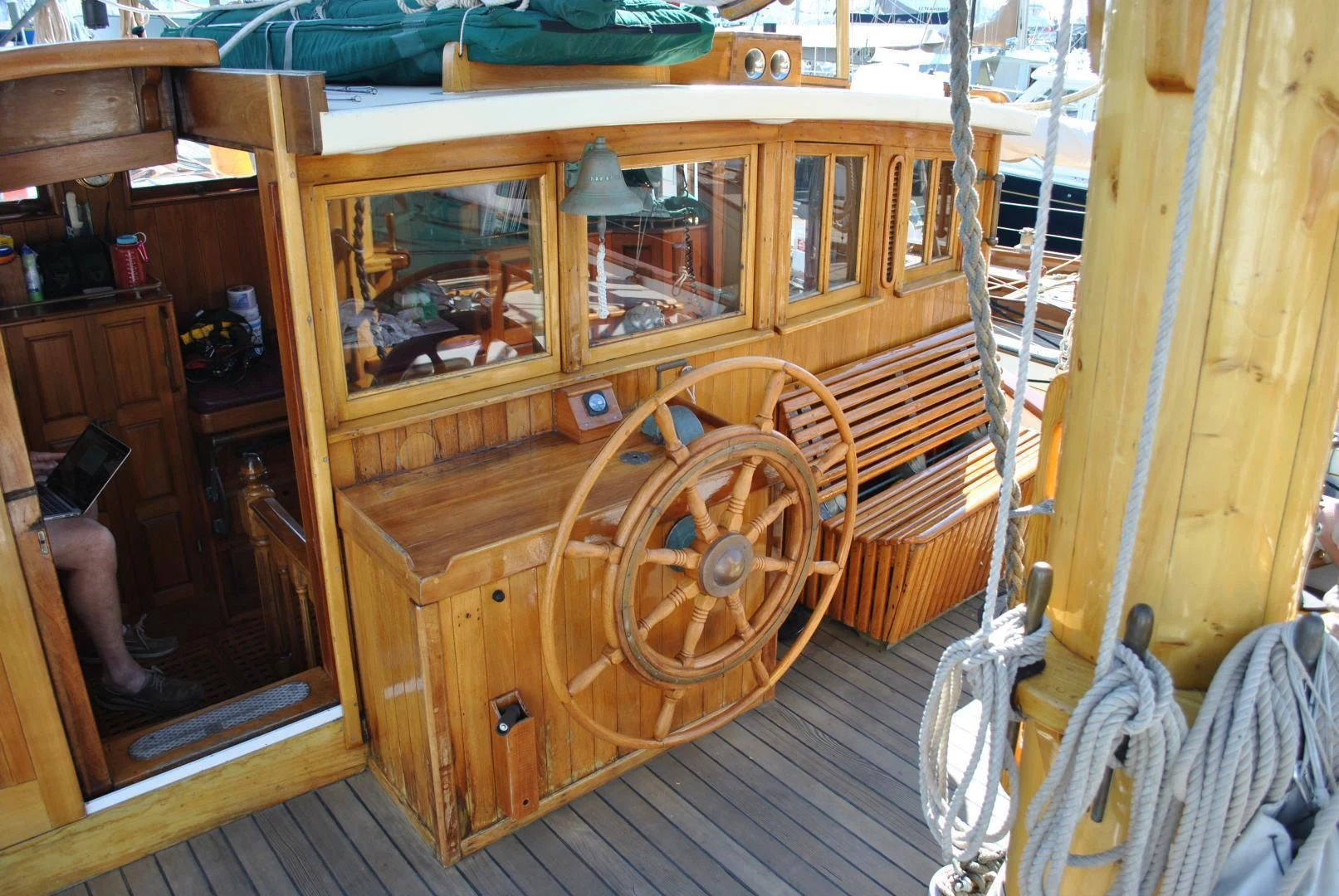 a wooden boat with a wooden steering wheel aboard TREE OF LIFE Yacht for Sale