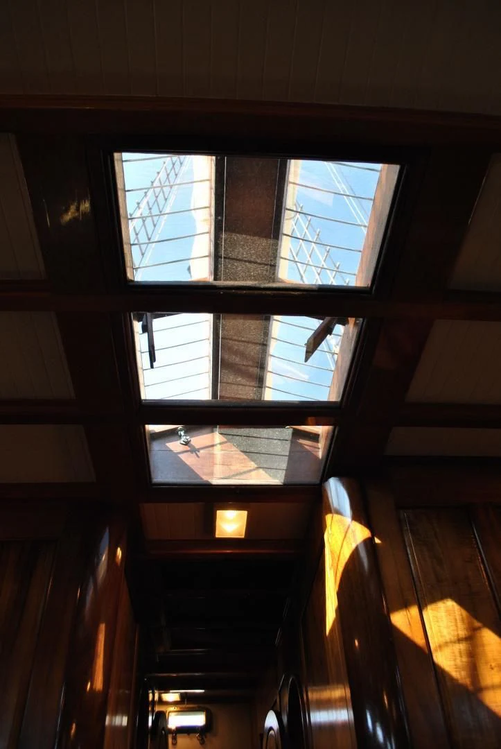 a window with a view of a street aboard TREE OF LIFE Yacht for Sale