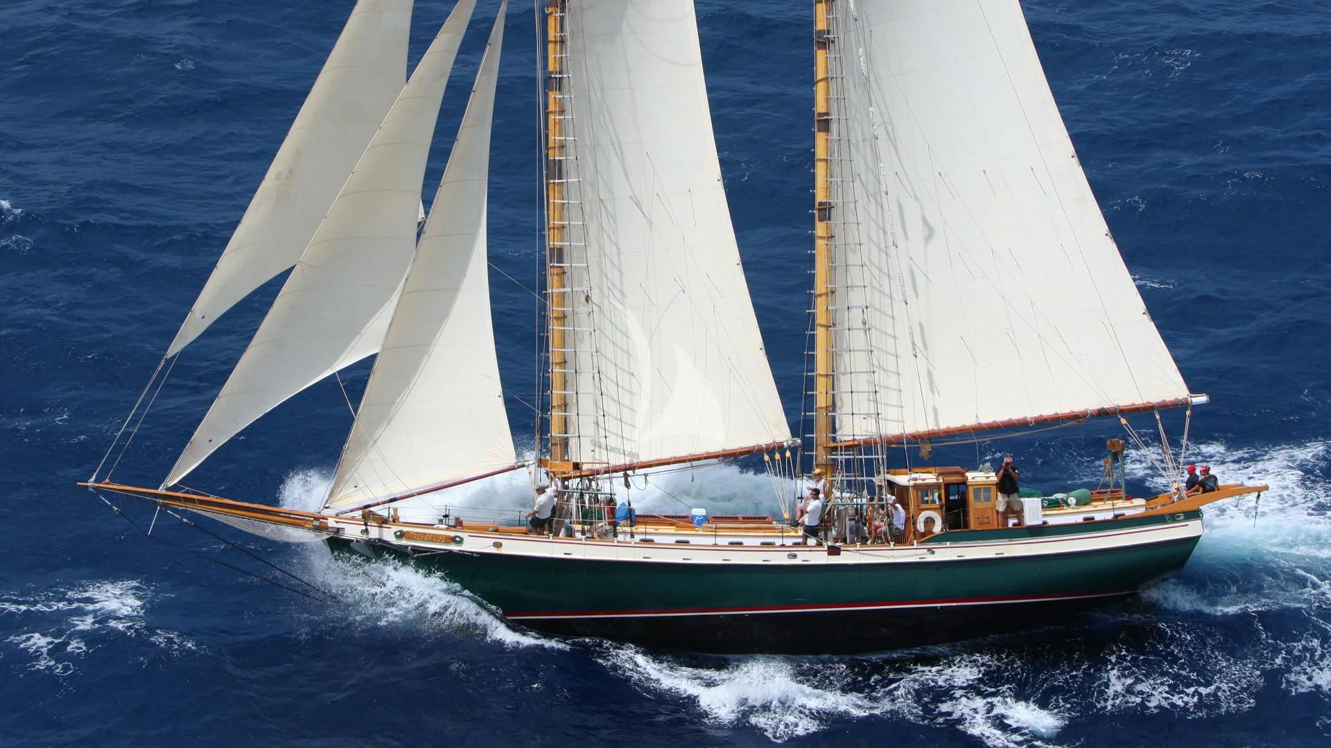 a boat with sails on the water aboard TREE OF LIFE Yacht for Sale