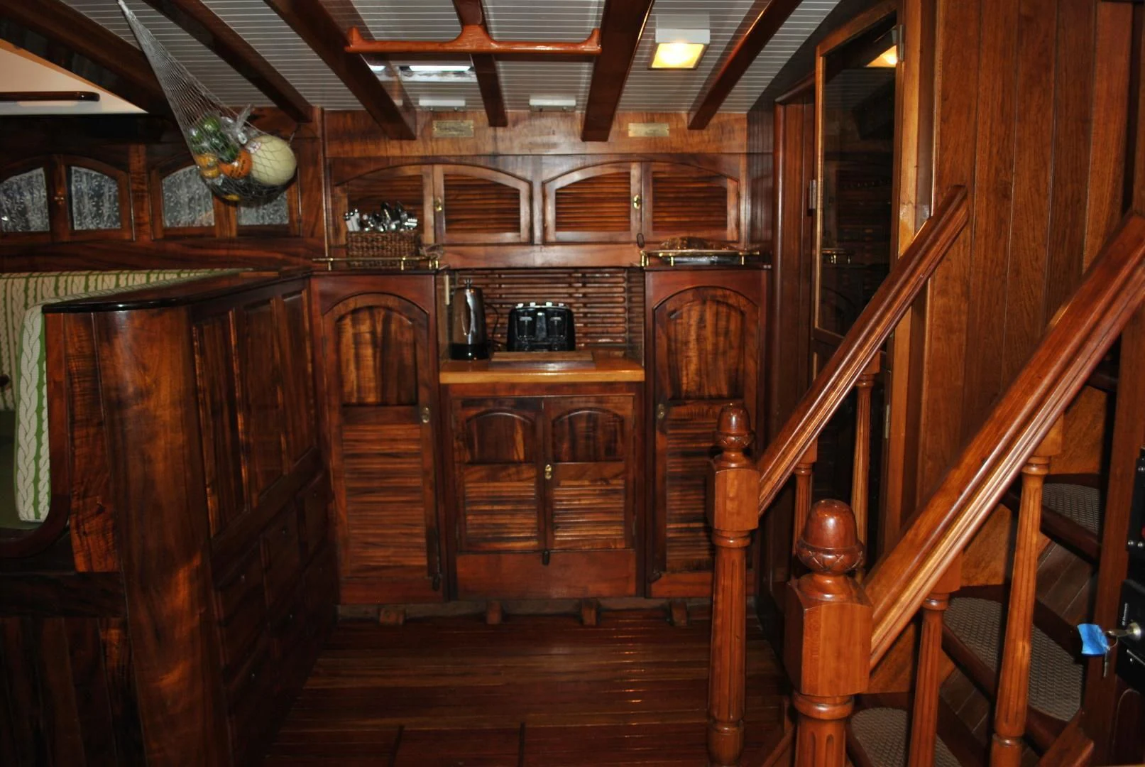 a kitchen with wooden cabinets aboard TREE OF LIFE Yacht for Sale