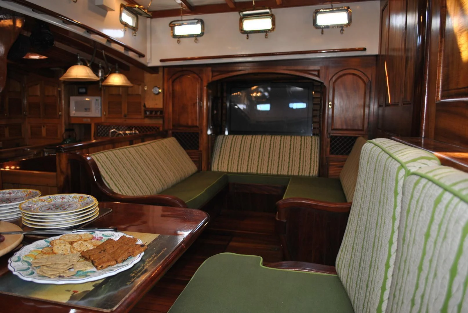 a table with a plate of food aboard TREE OF LIFE Yacht for Sale