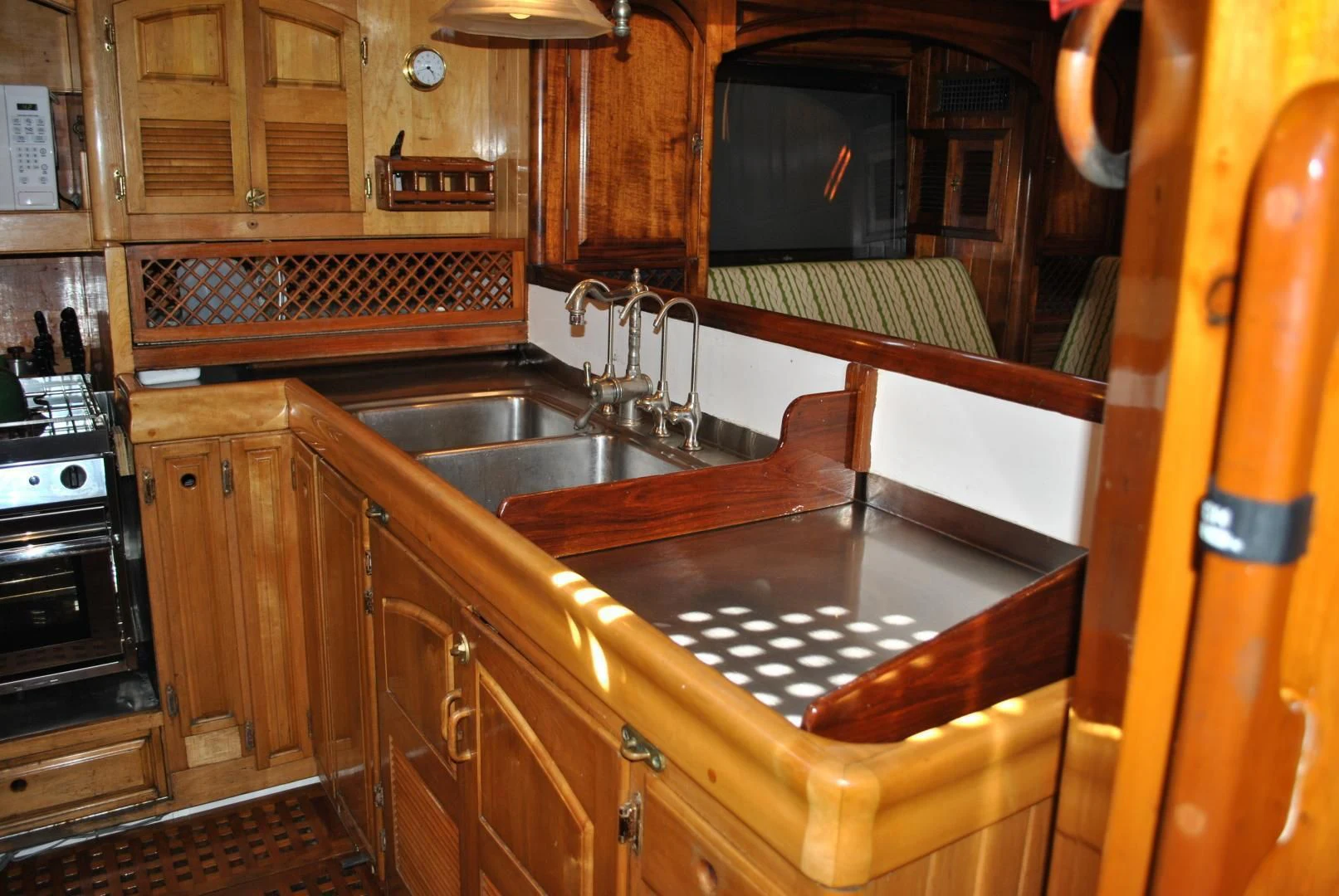a kitchen with wooden cabinets aboard TREE OF LIFE Yacht for Sale