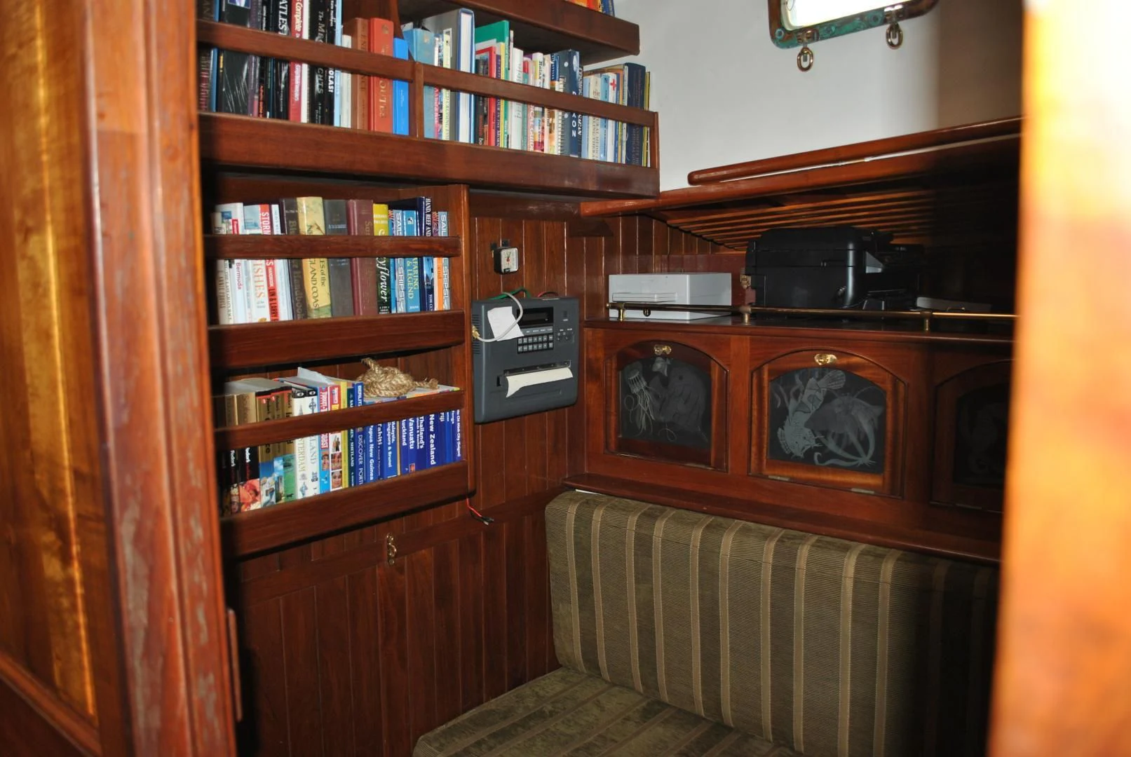 a shelf with a stereo and a bookcase aboard TREE OF LIFE Yacht for Sale
