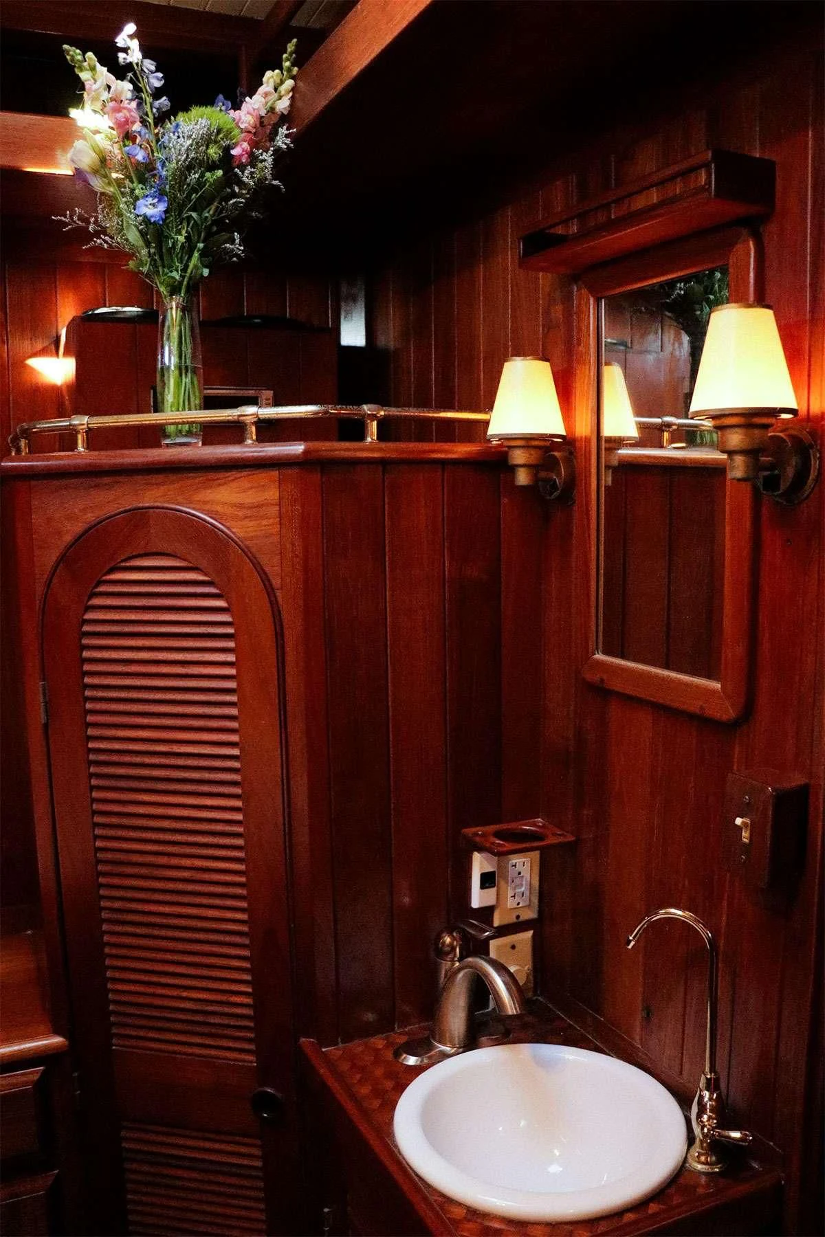 a bathroom with a sink and a mirror aboard TREE OF LIFE Yacht for Sale