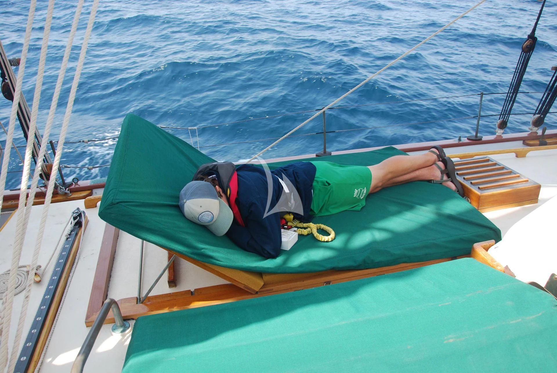 a person lying on a boat aboard TREE OF LIFE Yacht for Sale