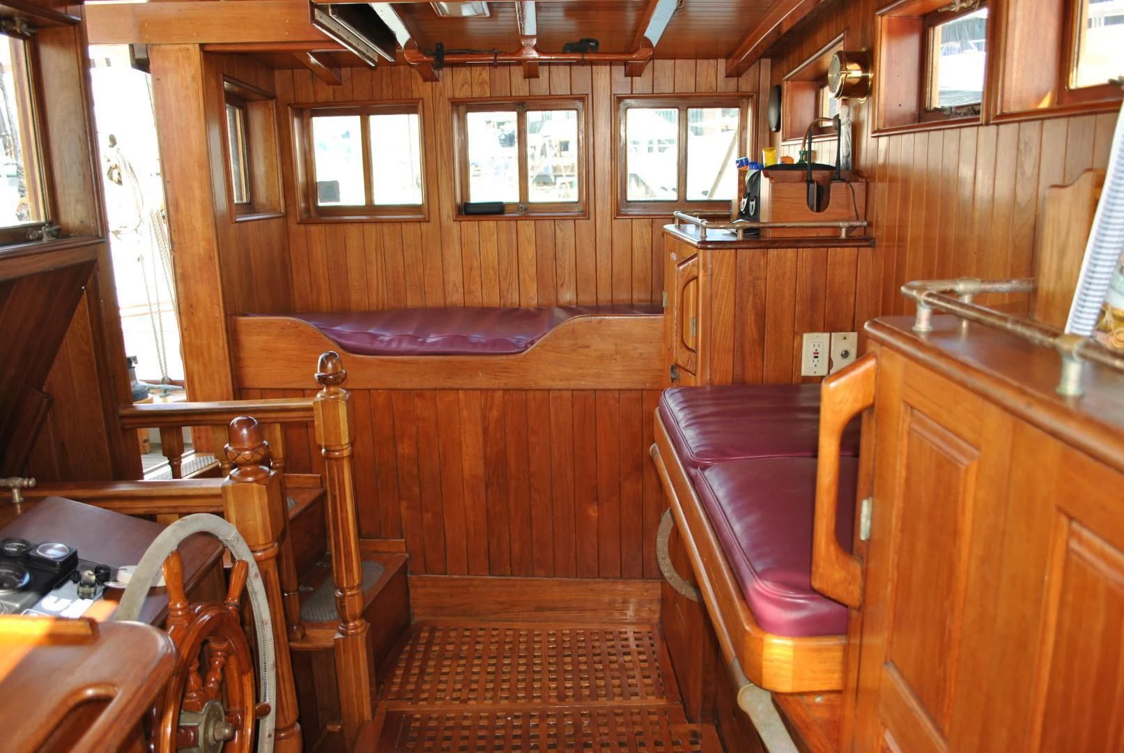 a cabin with a bed and chairs aboard TREE OF LIFE Yacht for Sale