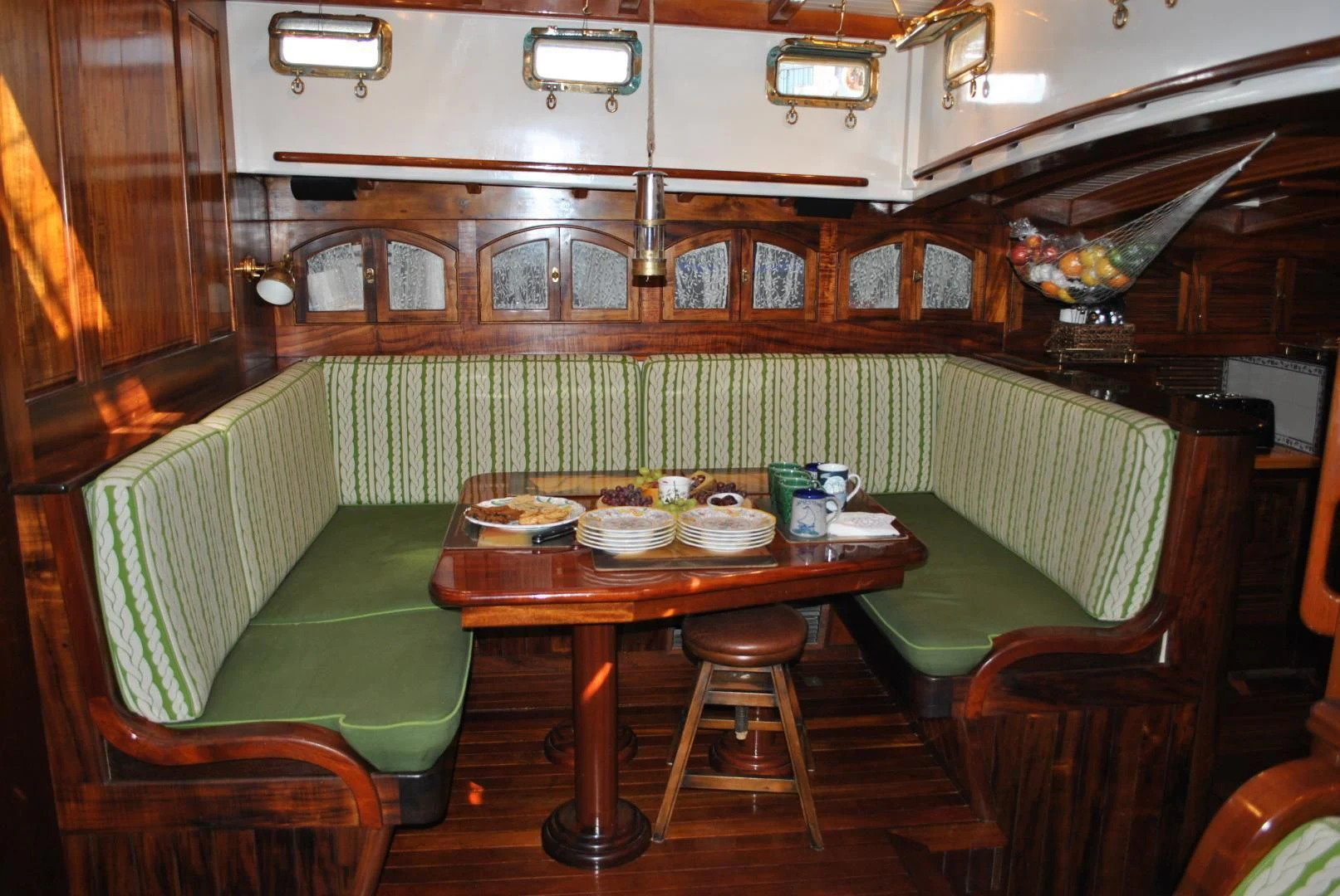 a table with a couple of seats aboard TREE OF LIFE Yacht for Sale