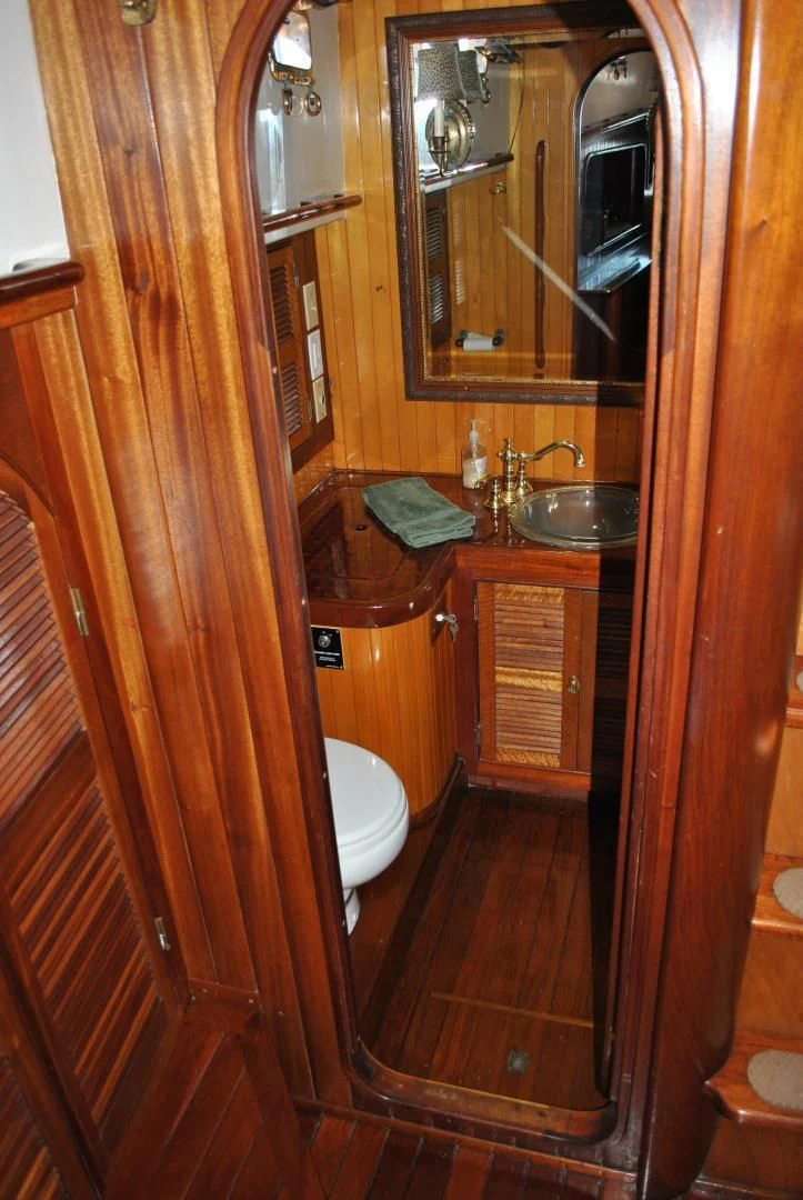 a bathroom with a sink and a toilet aboard TREE OF LIFE Yacht for Sale