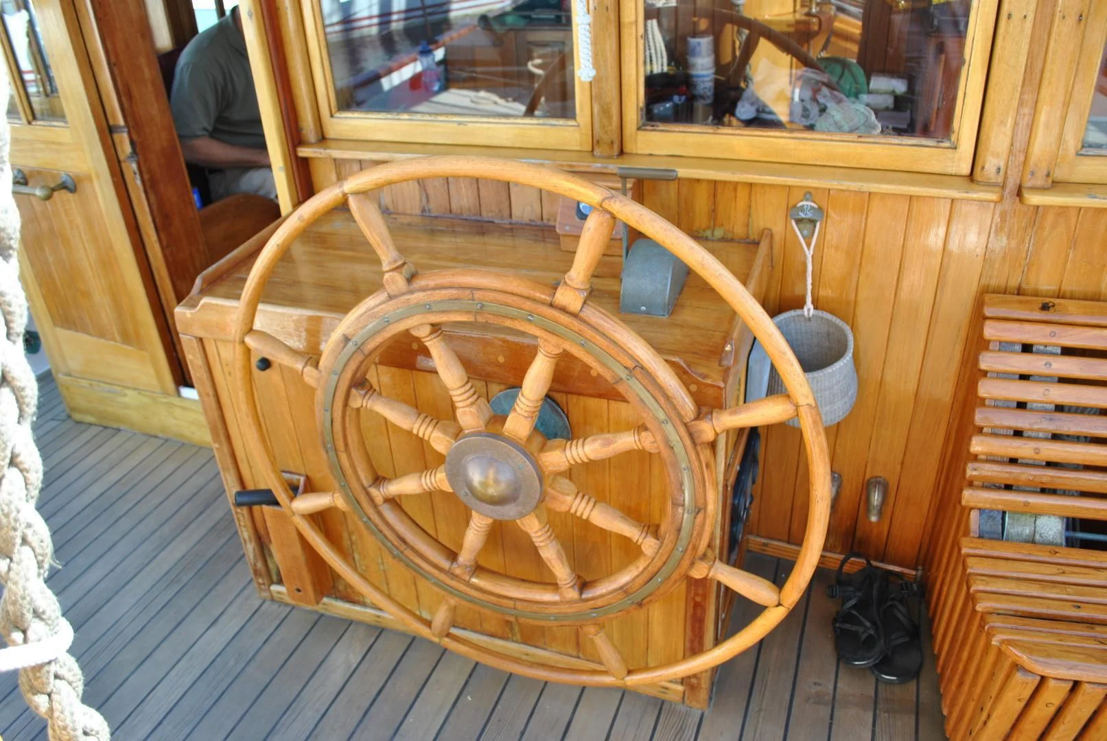 a wooden wheel on a wooden surface aboard TREE OF LIFE Yacht for Sale