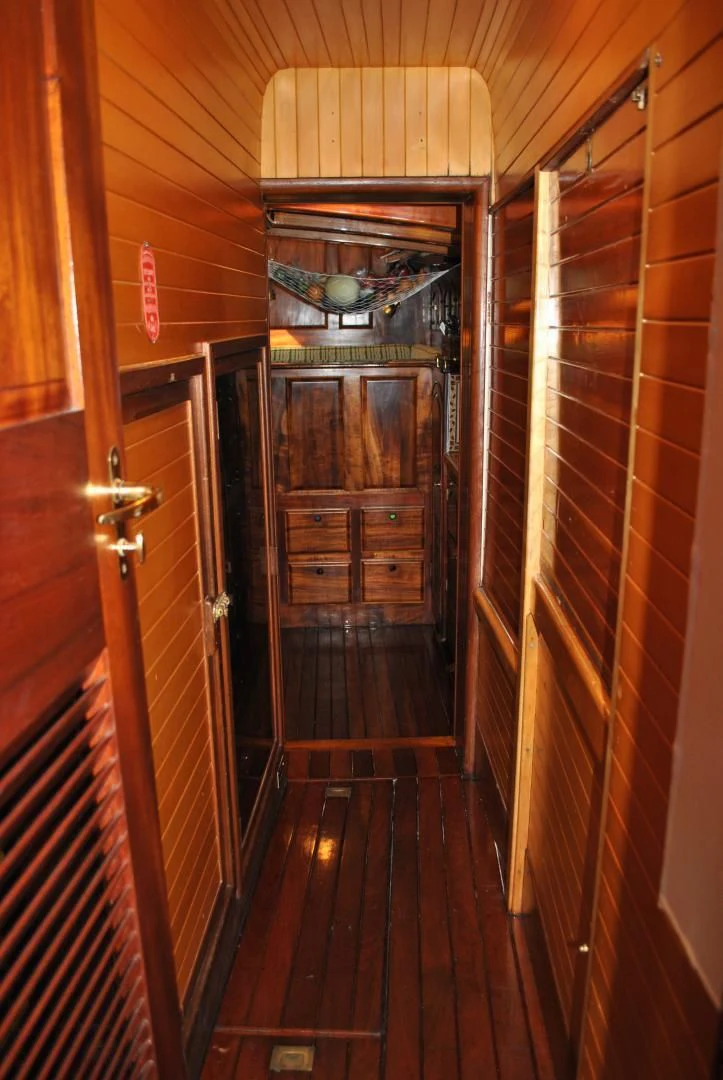 a room with a wood door and a mirror aboard TREE OF LIFE Yacht for Sale