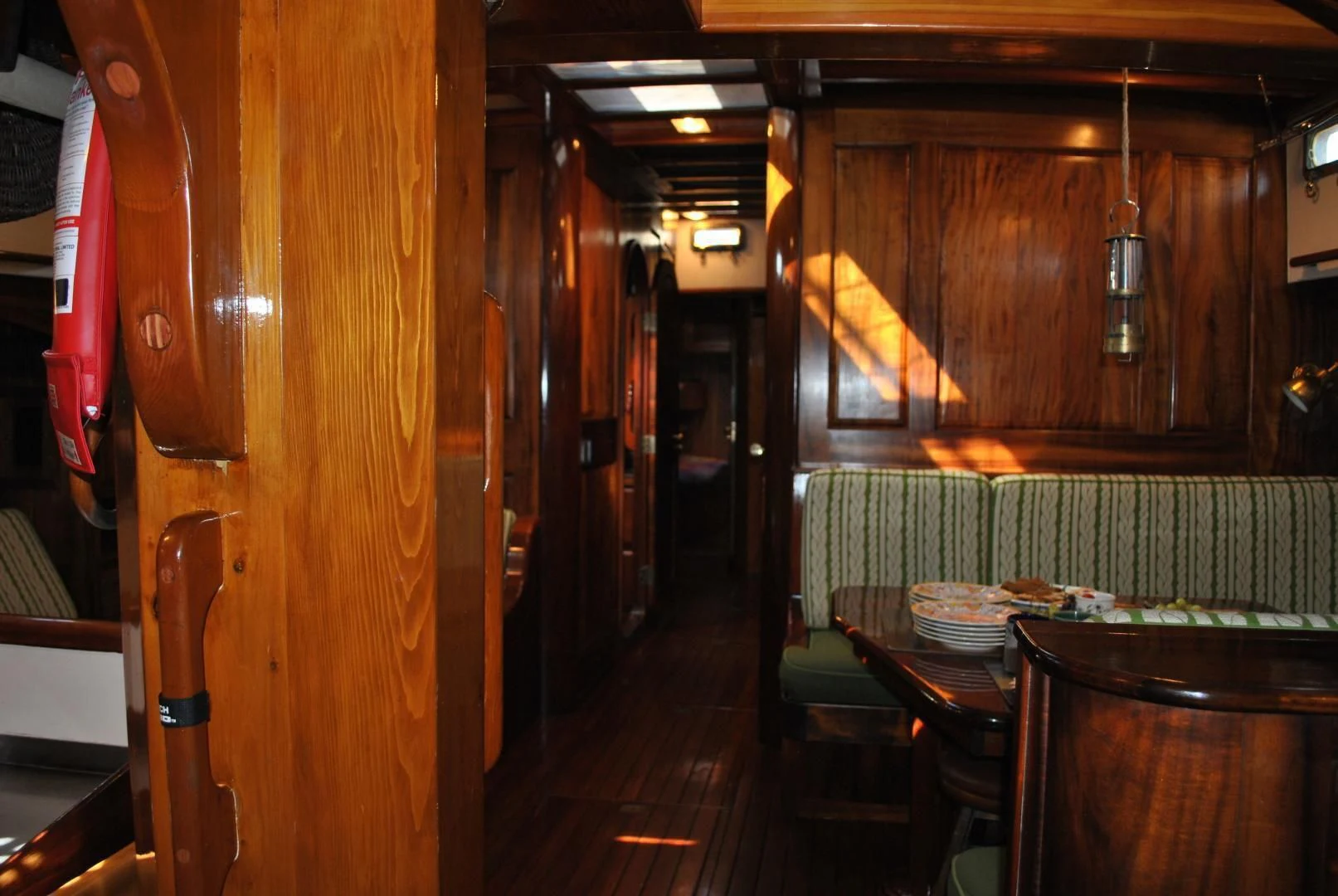 a room with tables and chairs aboard TREE OF LIFE Yacht for Sale