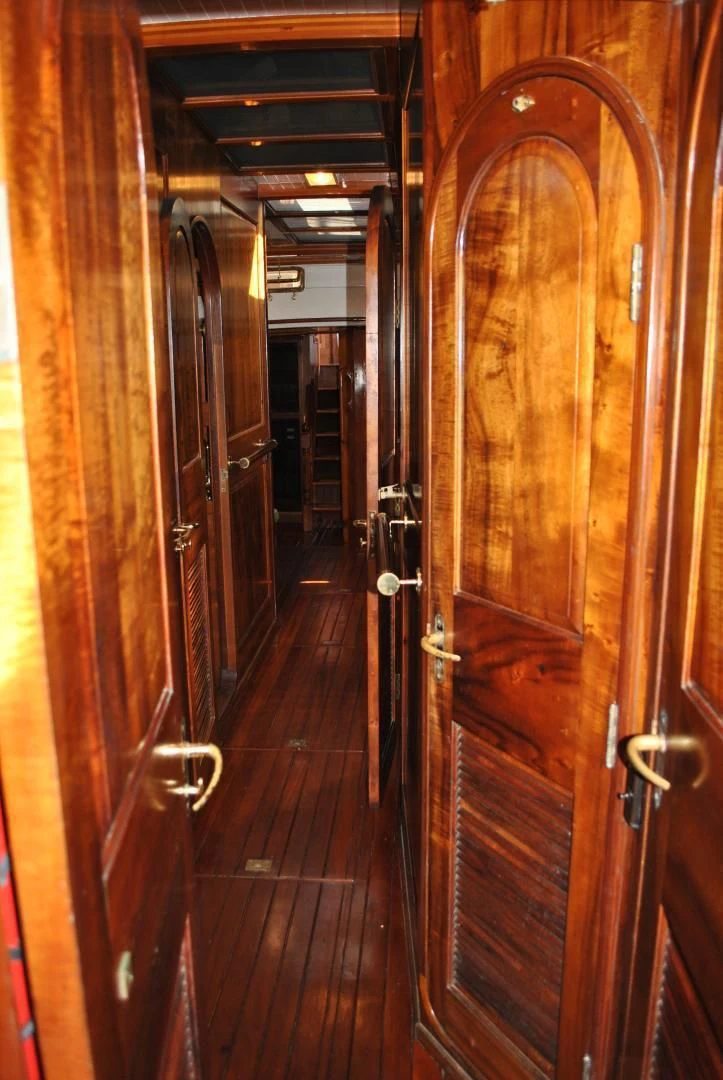 a wood door in a hallway aboard TREE OF LIFE Yacht for Sale