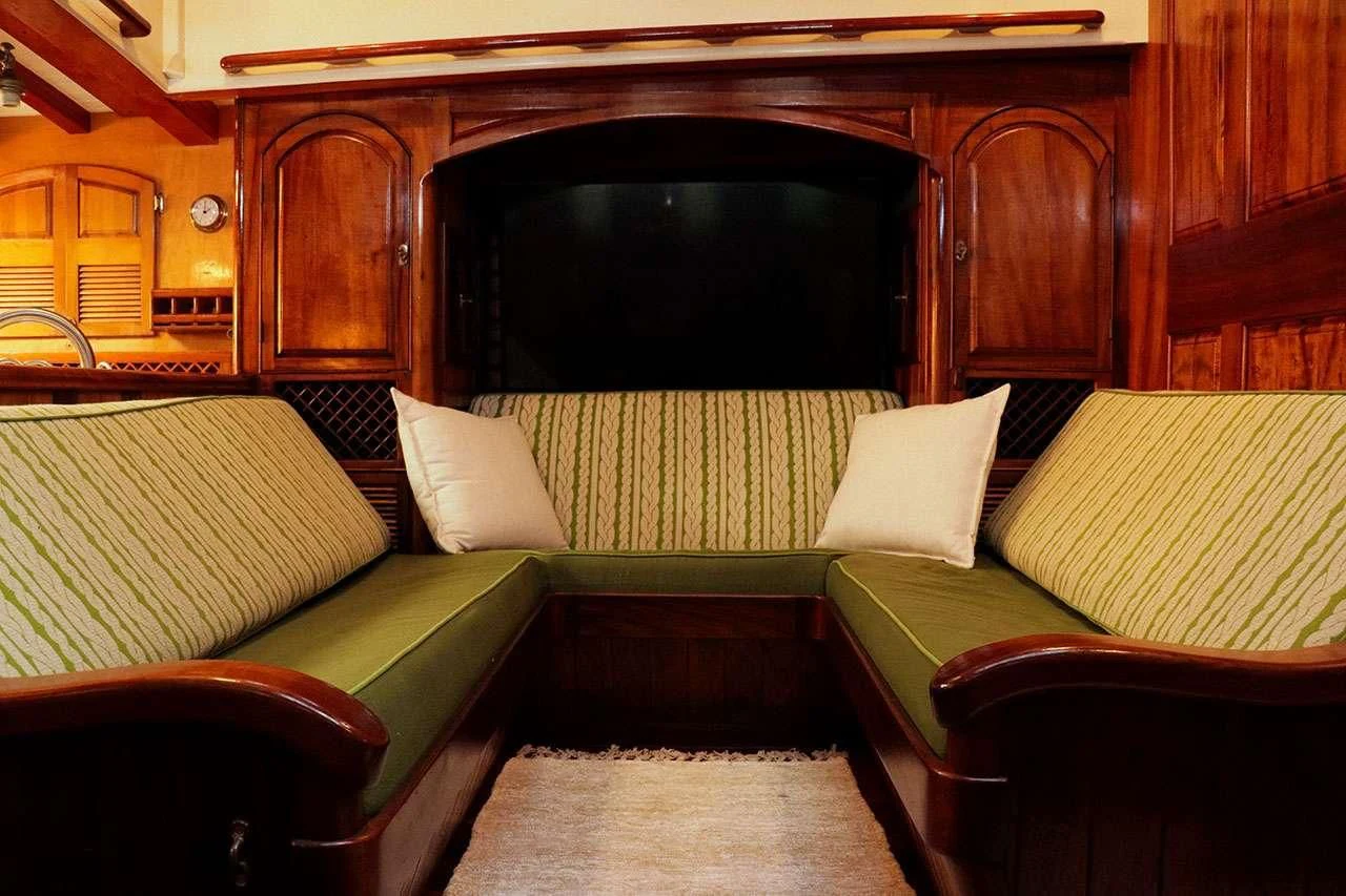 a room with couches and a table aboard TREE OF LIFE Yacht for Sale