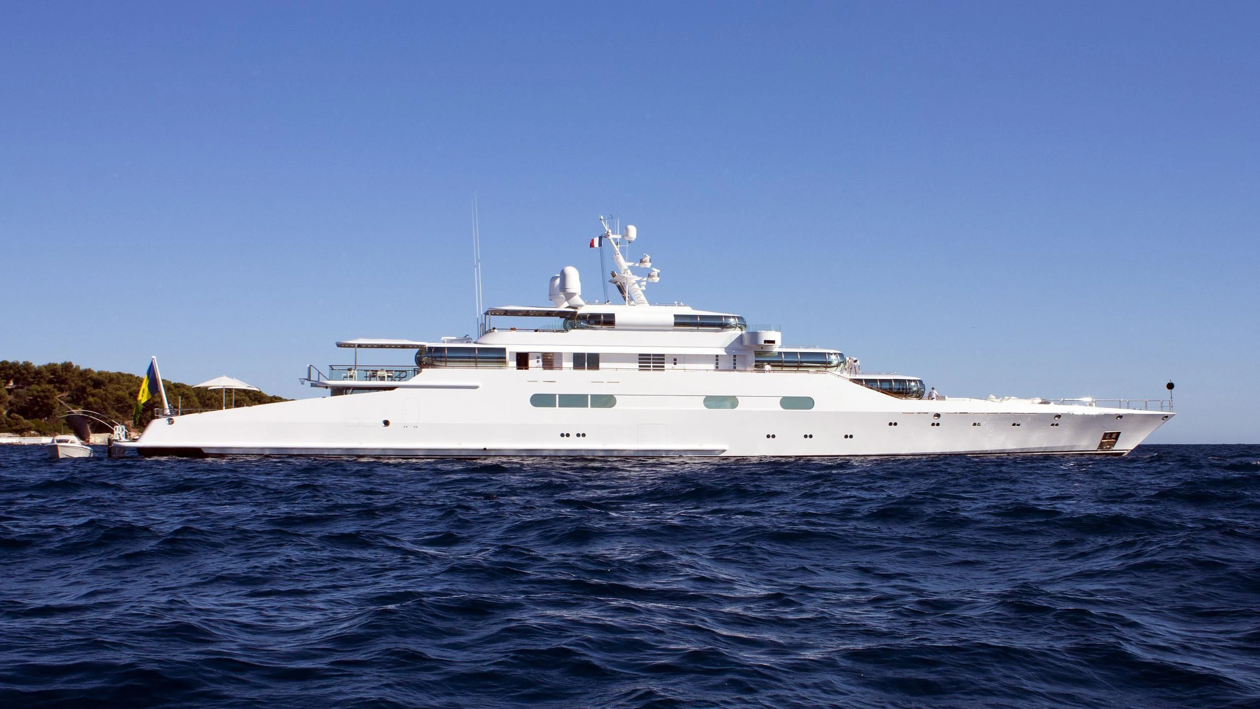 a large white boat in the water aboard ZEUS Yacht for Sale