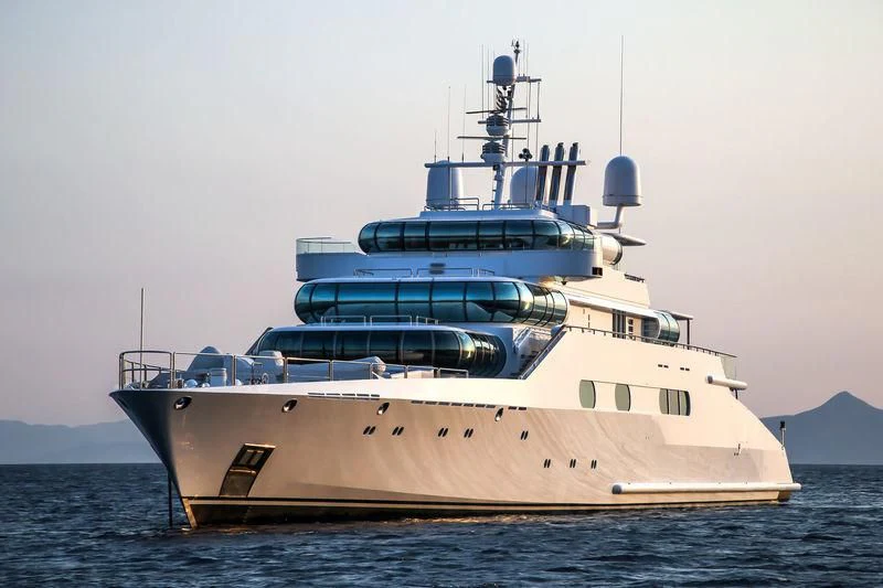 a large white ship in the water aboard ZEUS Yacht for Sale