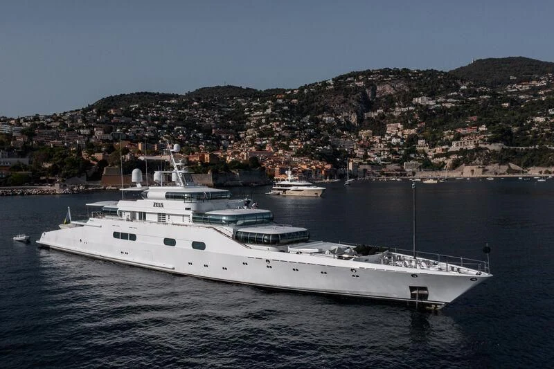 a large white boat in the water aboard ZEUS Yacht for Sale