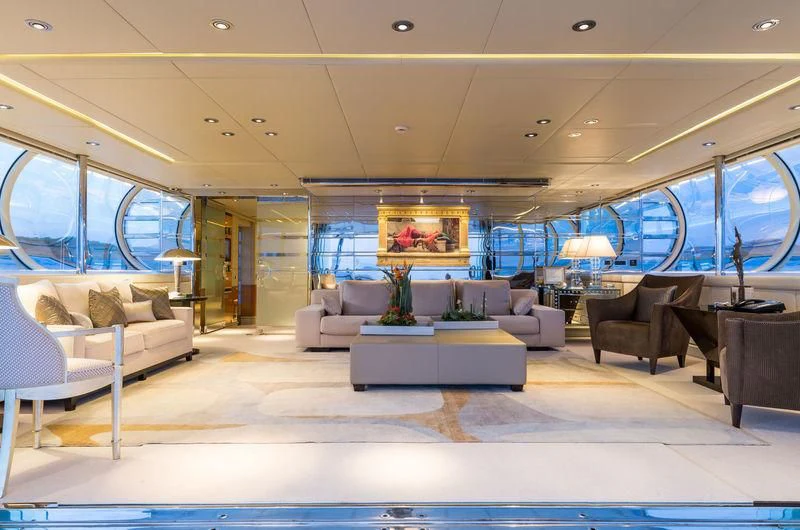 a large living room with a large window aboard ZEUS Yacht for Sale
