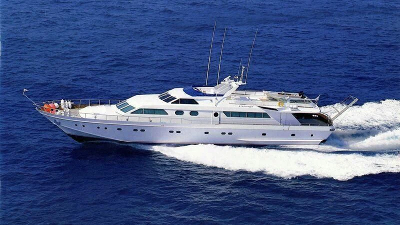 a white yacht in the water aboard SOMETHING WILD Yacht for Sale