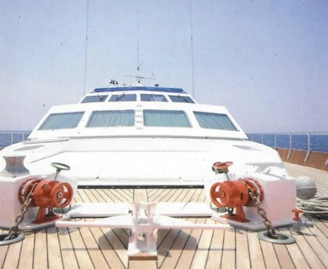 a white yacht on a deck aboard SOMETHING WILD Yacht for Sale