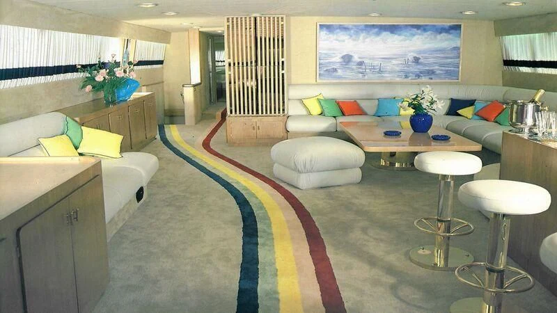 a room with a bed and a table aboard SOMETHING WILD Yacht for Sale