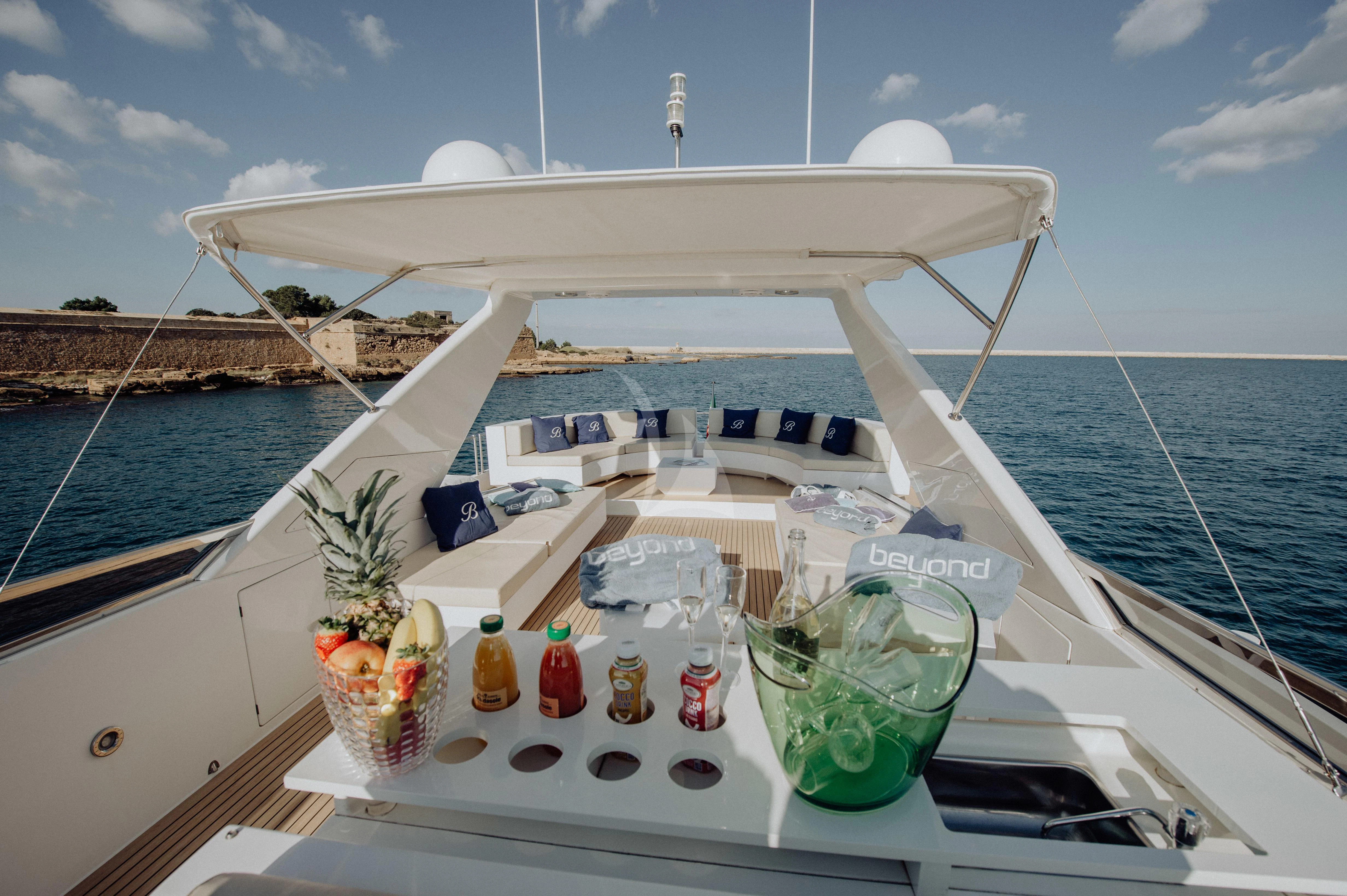 a boat with drinks on it aboard BEYOND Yacht for Charter