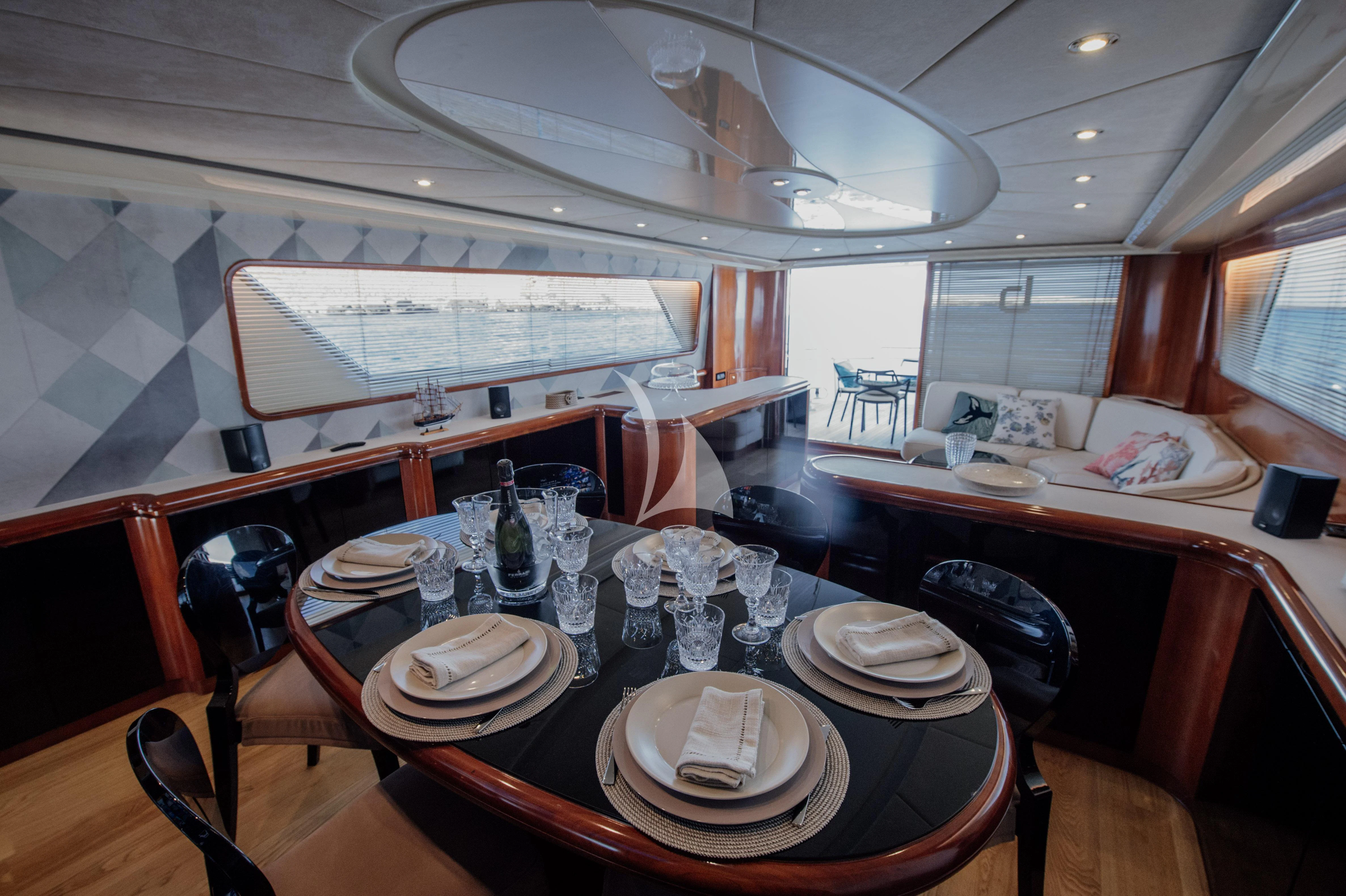 a dining room with a table set aboard BEYOND Yacht for Charter