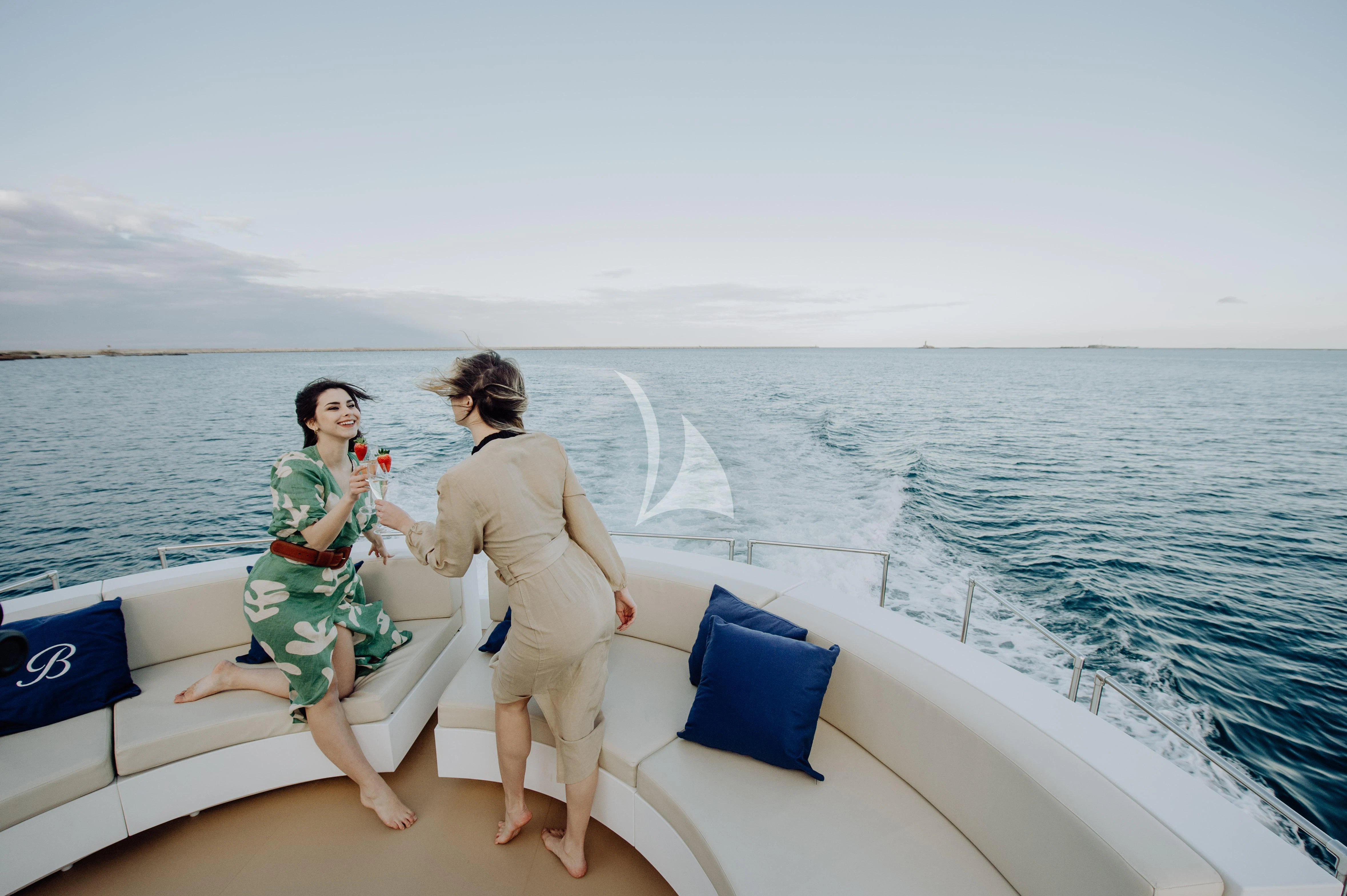 a man and woman on a boat aboard BEYOND Yacht for Charter