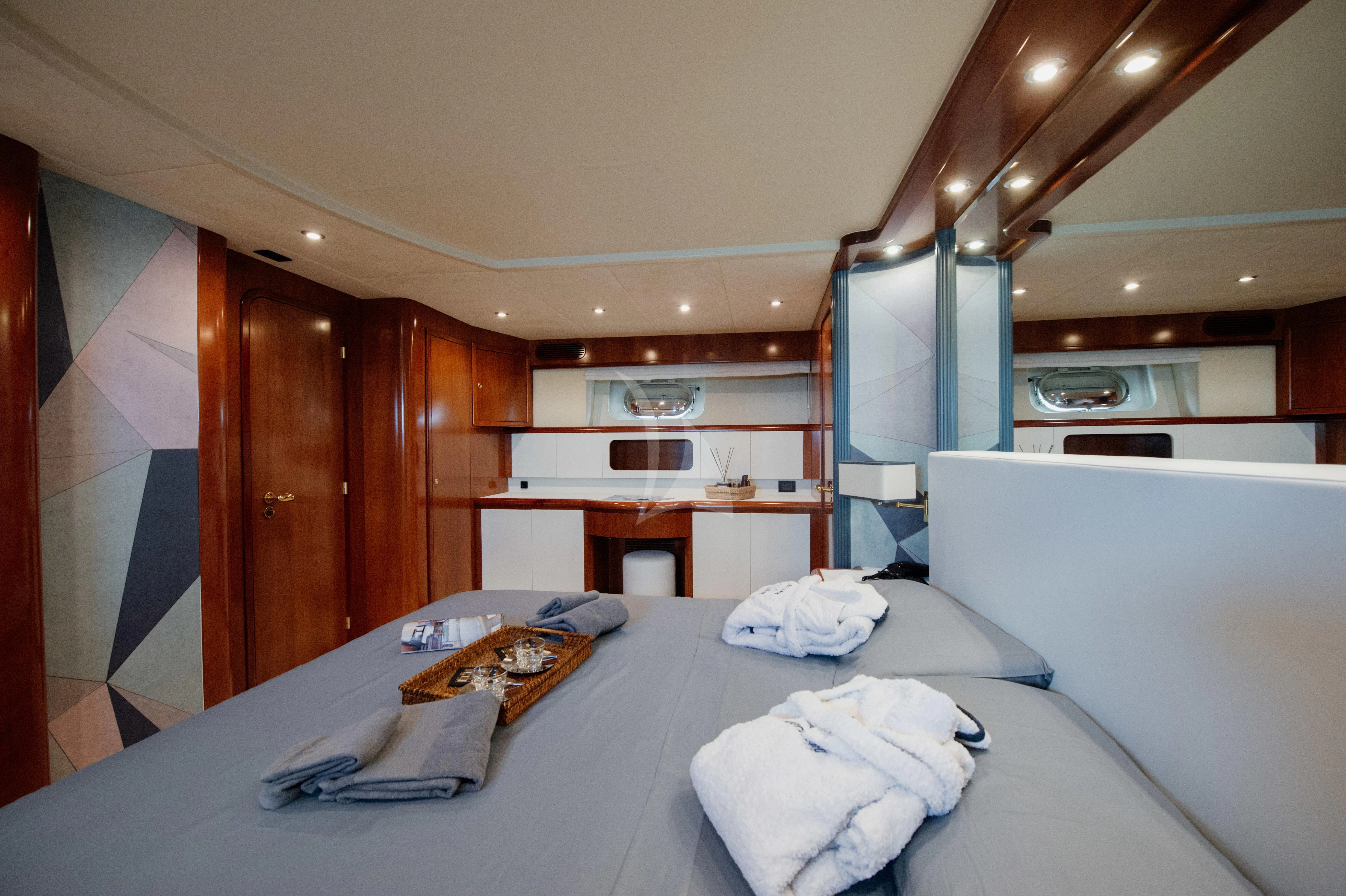 a large white bed in a room aboard BEYOND Yacht for Charter