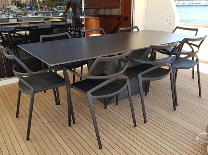 a table and chairs in a room aboard BEYOND Yacht for Charter