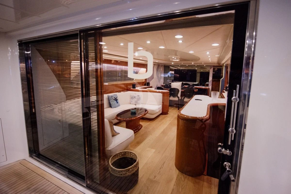a room with a glass door aboard BEYOND Yacht for Charter