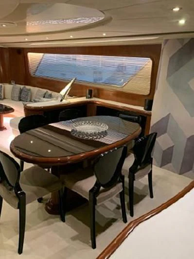 a table with a plate on it aboard BEYOND Yacht for Charter