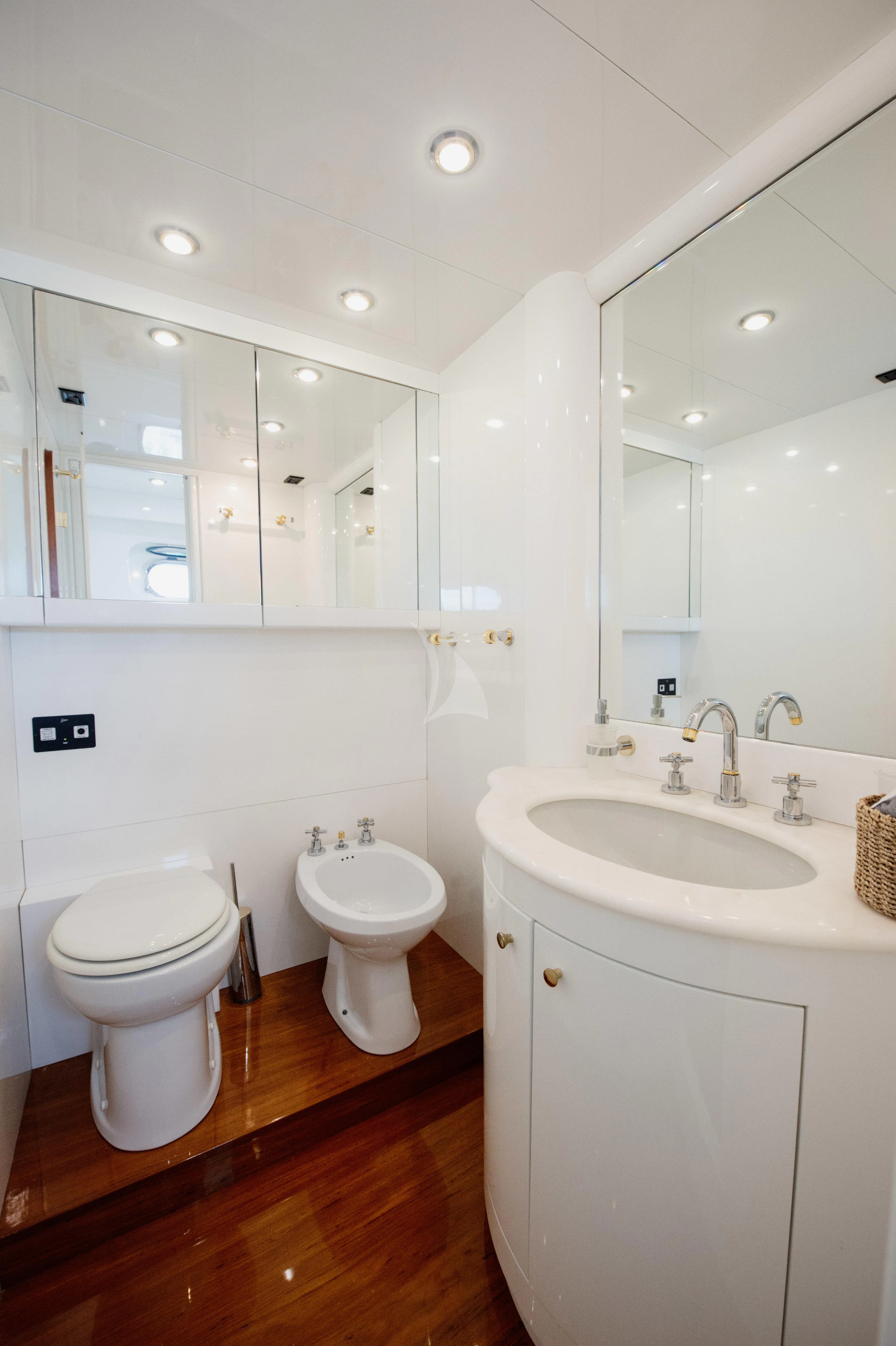 a bathroom with a toilet and a sink aboard BEYOND Yacht for Charter