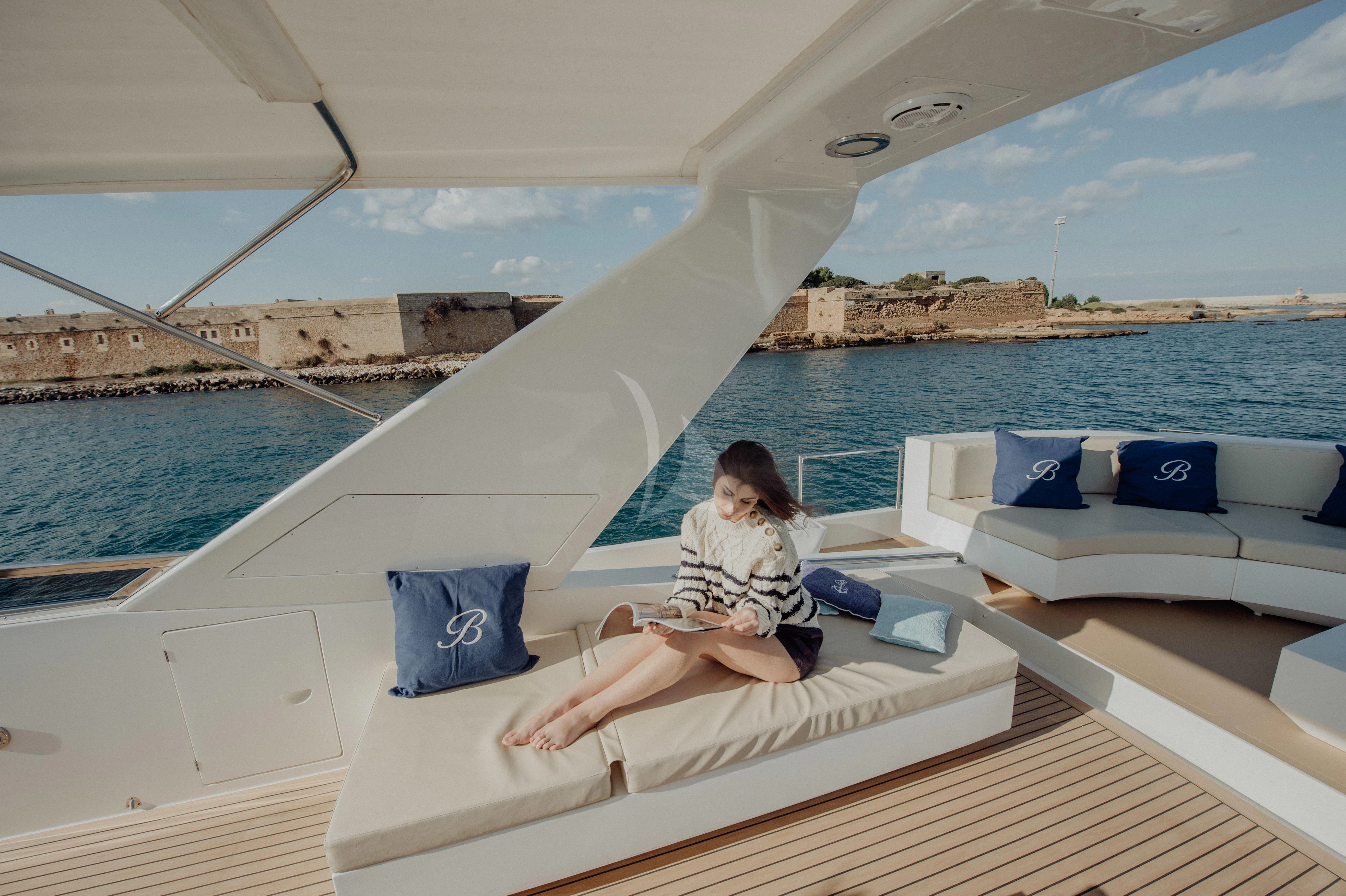 a person sitting on a boat aboard BEYOND Yacht for Charter